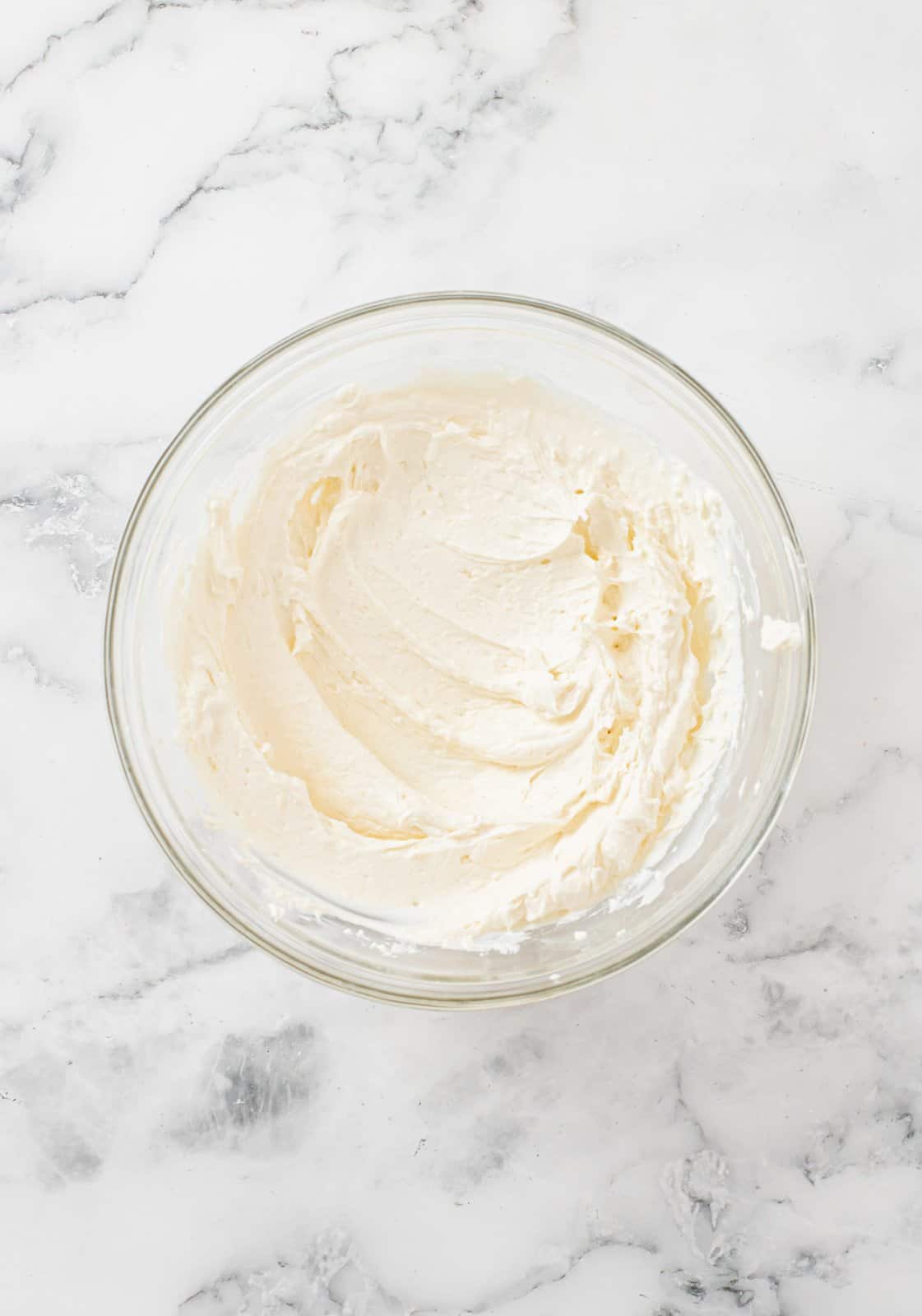 Cream cheese frosting in bowl.