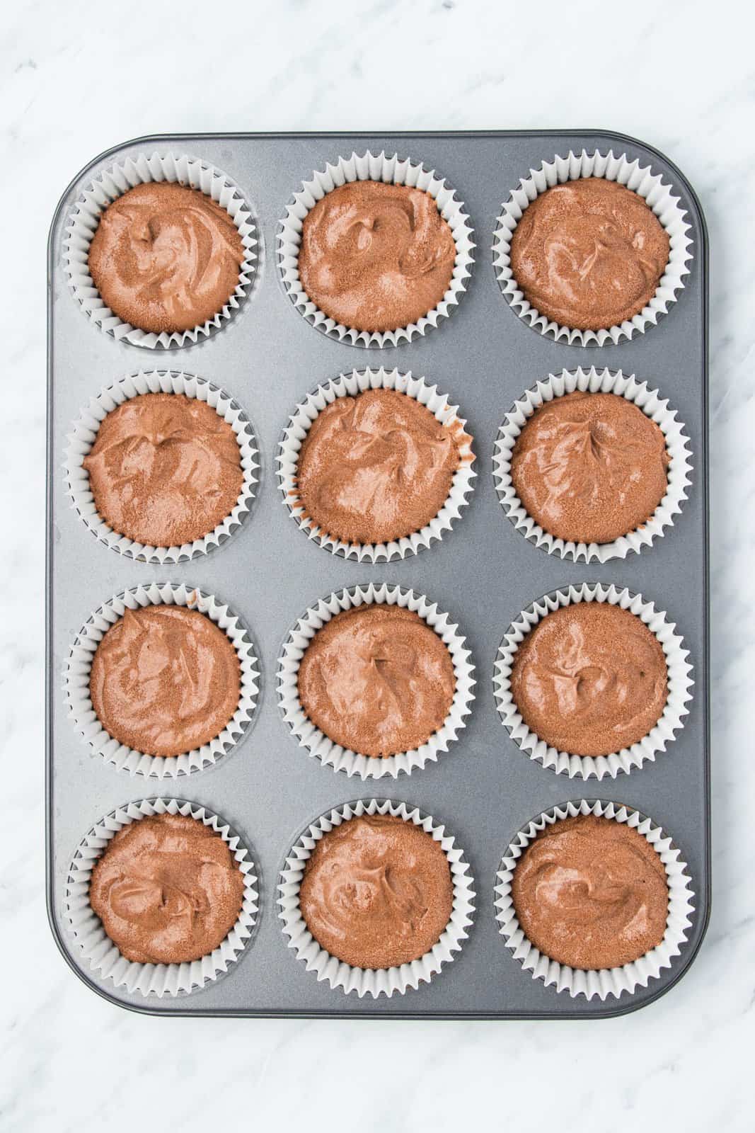 Batter portioned into cupcake pan.