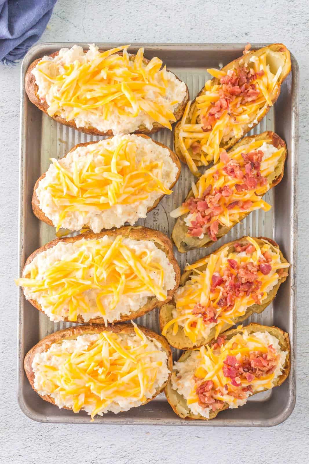 Potatoes topped with cheese and bacon.