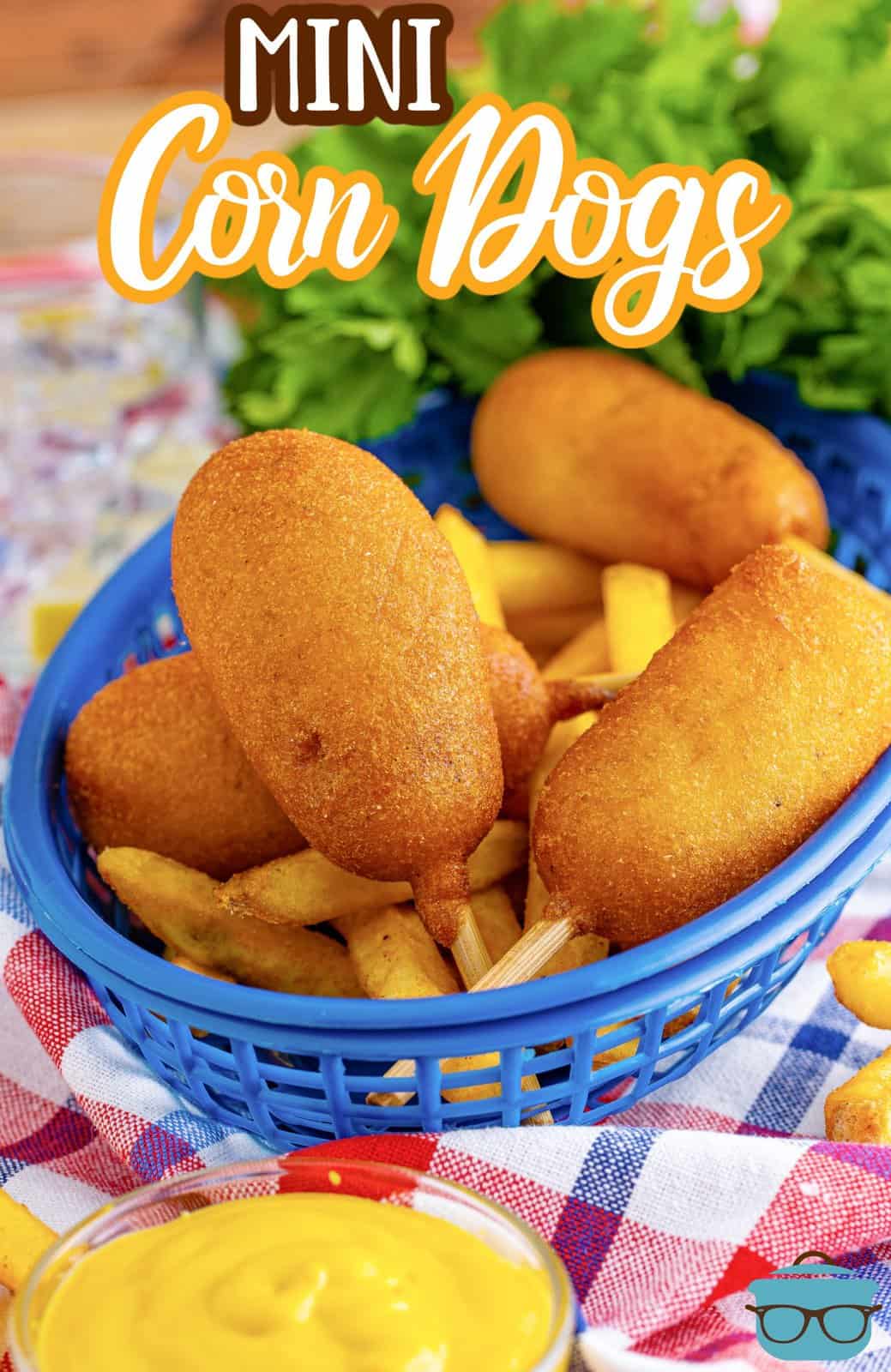 Pinterest image of blue basket layered with Mini Homemade Corn Dogs on top of French fries.