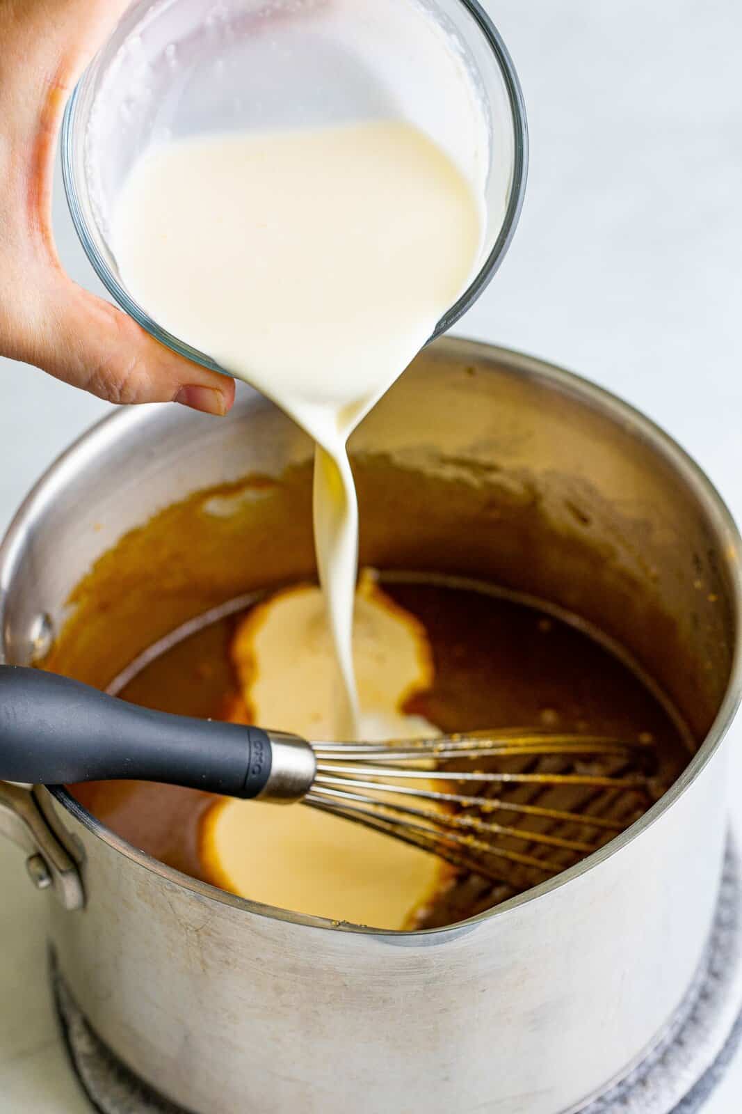 Evaporated milk and heavy cream added to melted brown sugar butter mixture.