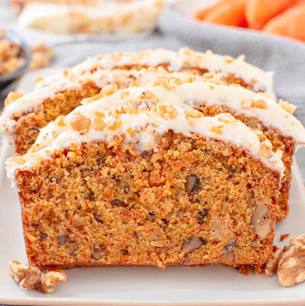 Close up square image of layered sliced Carrot Cake Loaf.