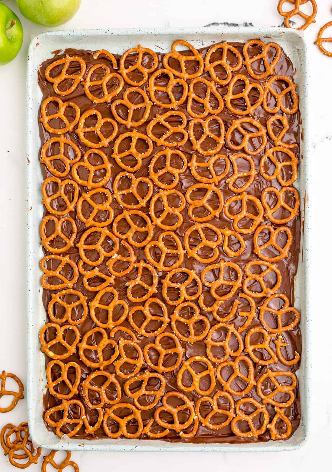 Pretzels placed over chocolate.