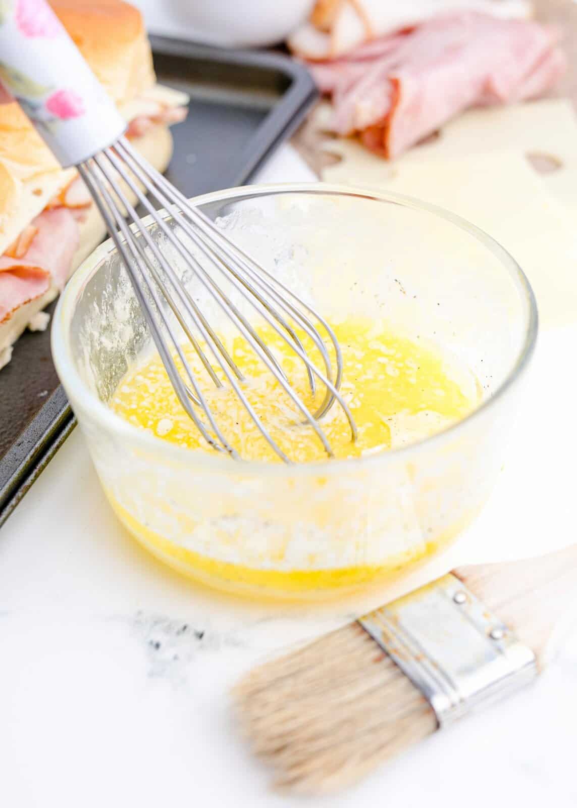 Butter, egg and pepper whisked together in bowl.