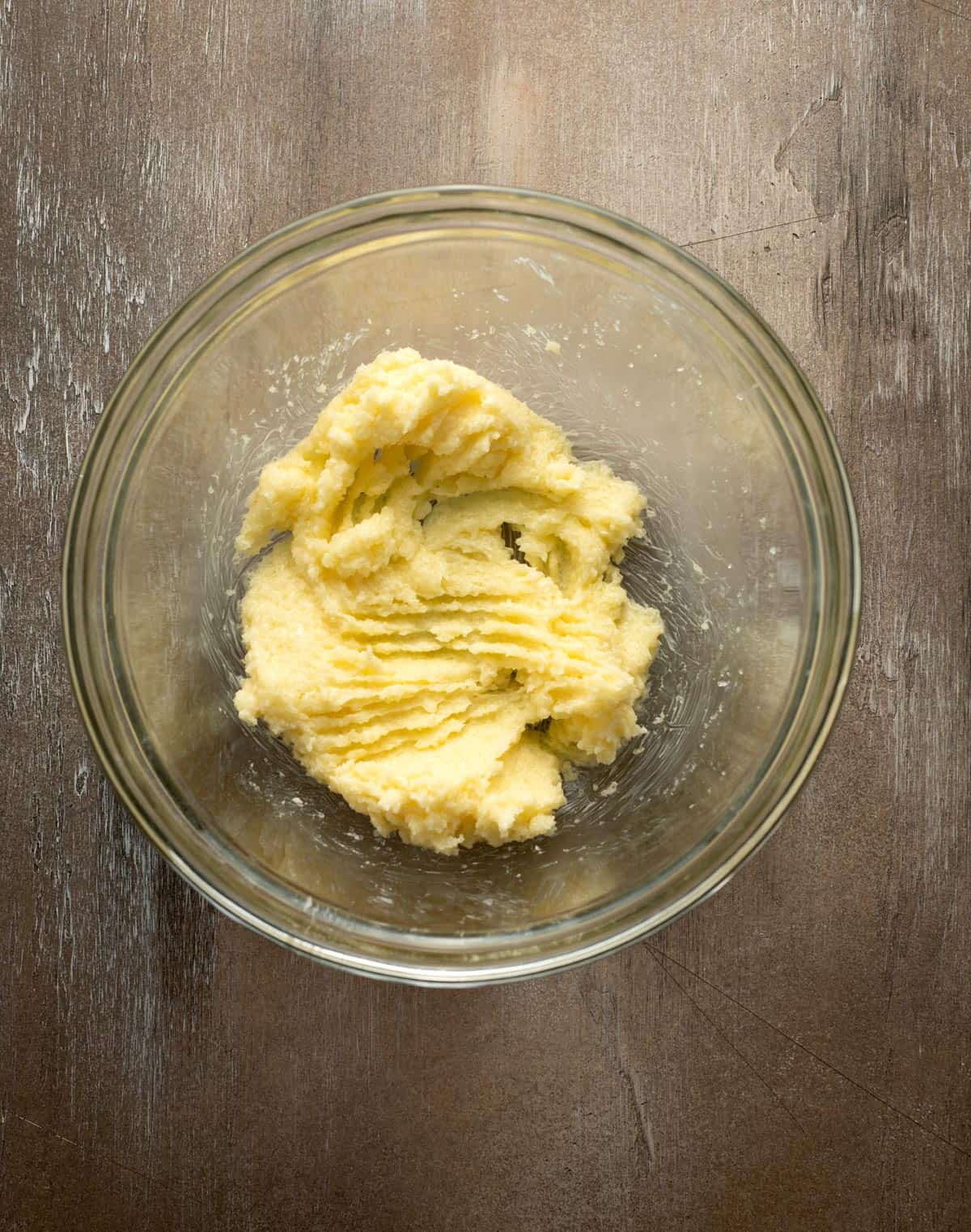 Butter and sugar mixed together in bowl.