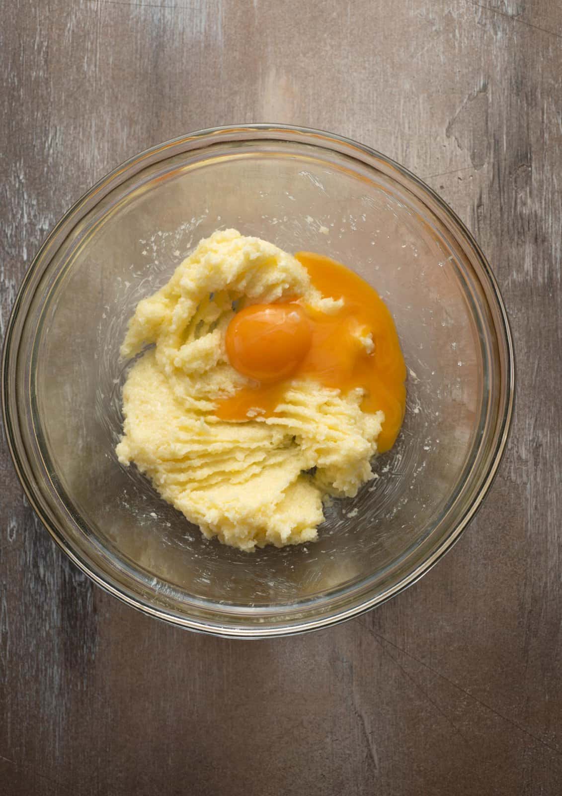 Egg yolks and vanilla added to butter and sugar mixture.