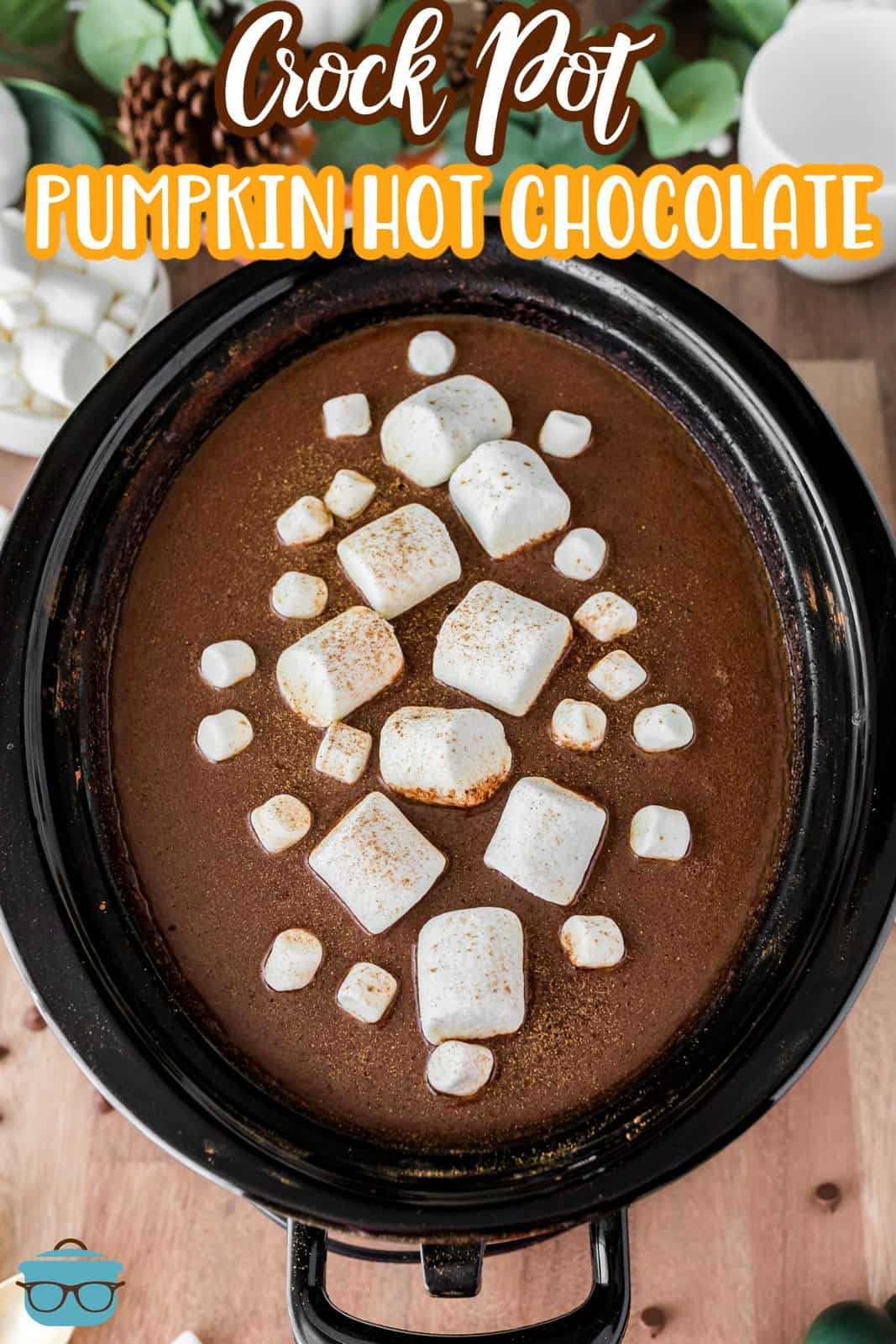 Pinterest image of Crock Pot Pumpkin Hot Chocolate in crock pot with marshmallows.