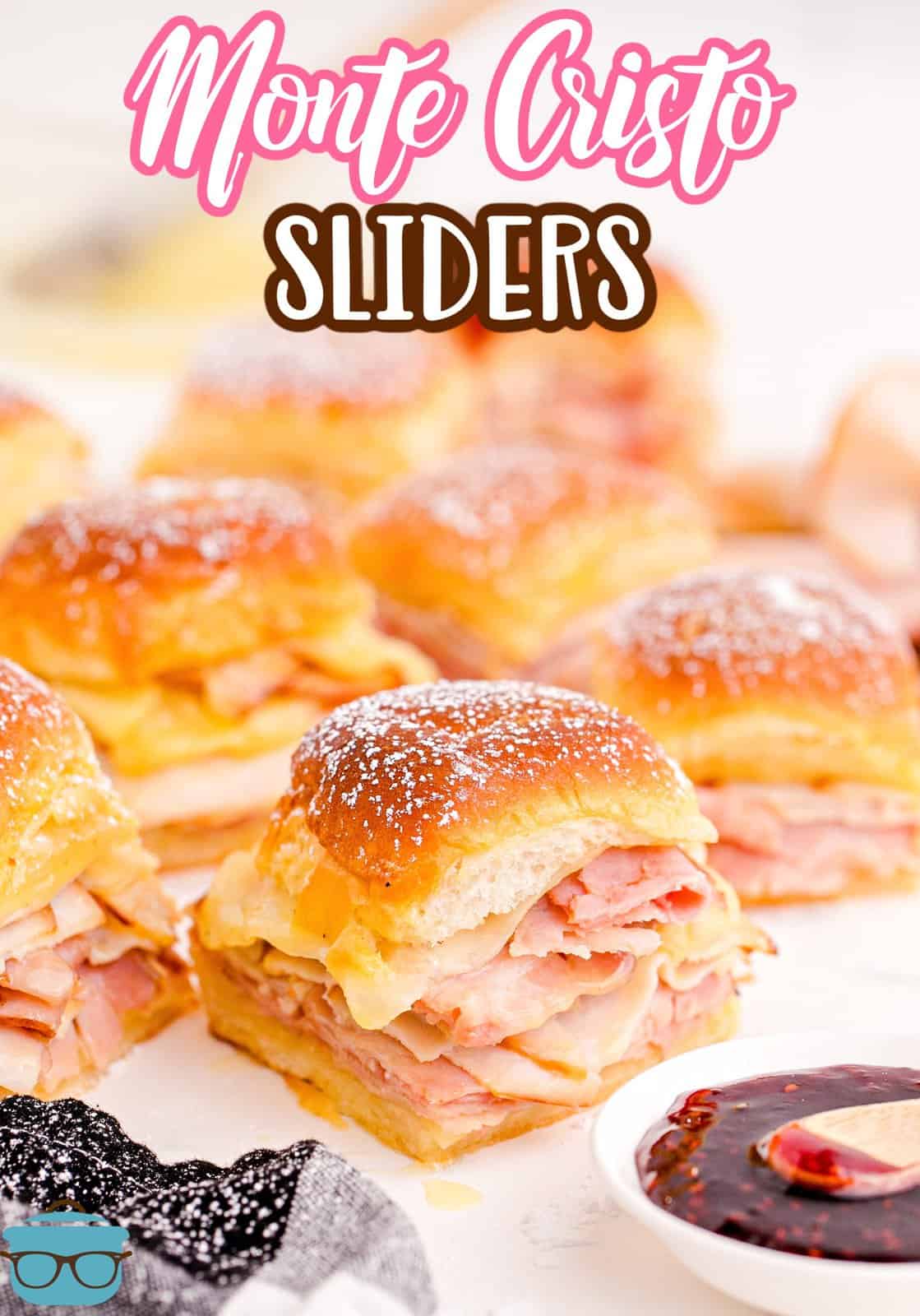 Pinterest image of cut up and spread out Monte Cristo Sliders with preserves in front.
