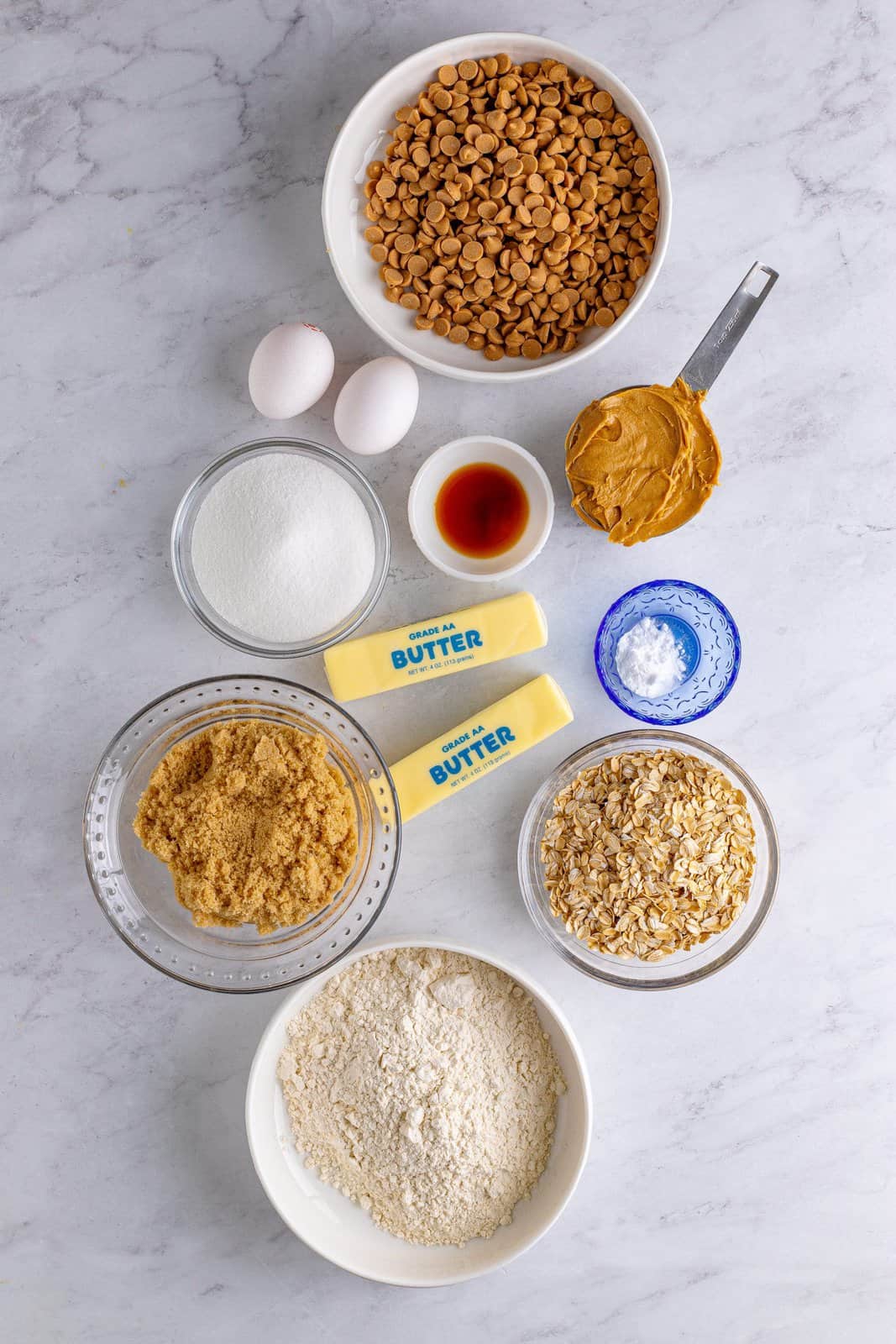 Ingredients needed: all-purpose flour, baking soda, creamy peanut butter, unsalted butter, light brown sugar, granulated sugar, eggs, vanilla extract, old fashioned oats and peanut butter chips.
