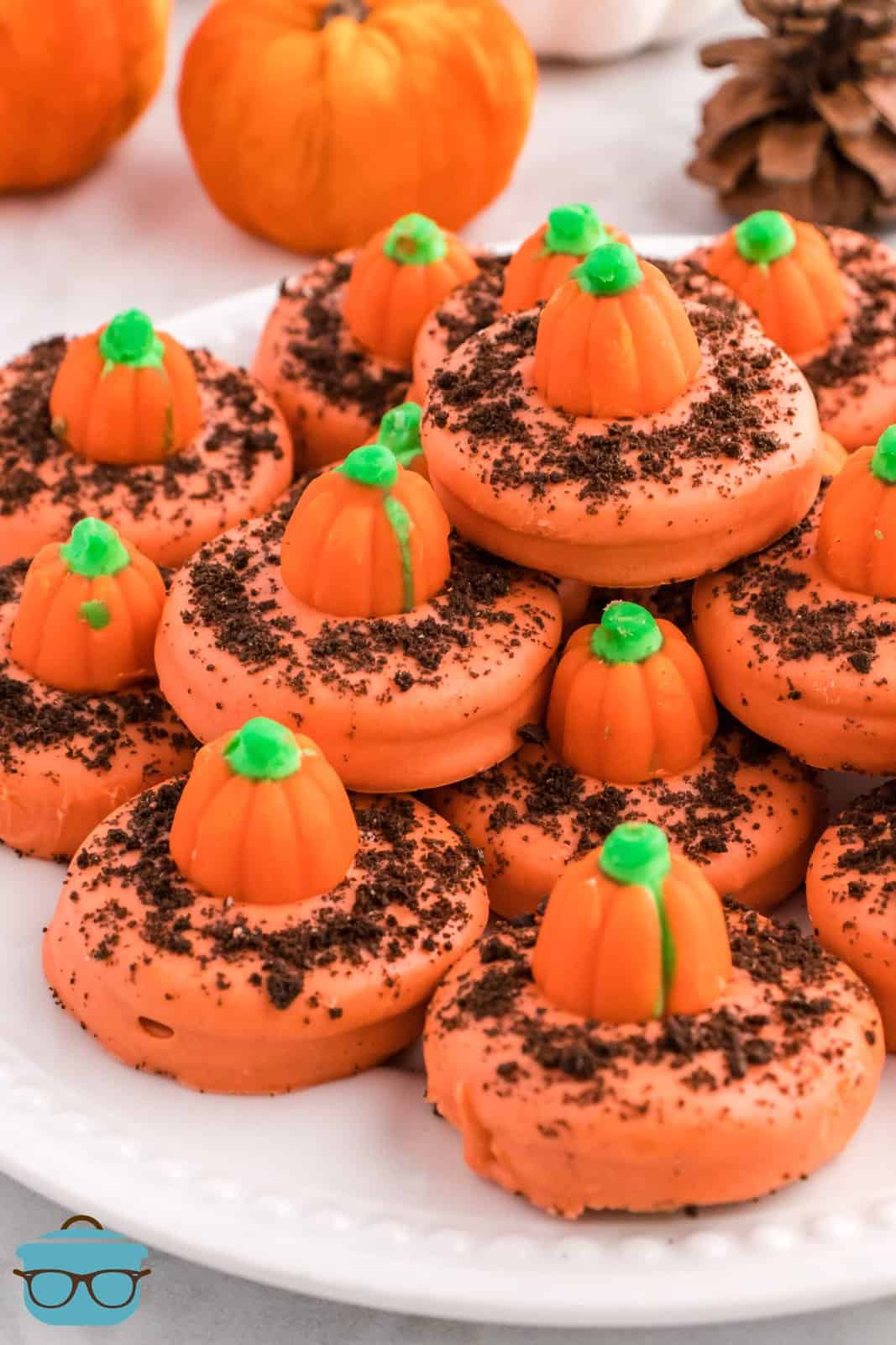 Pumpkin Patch Cookies stacked on white platter.