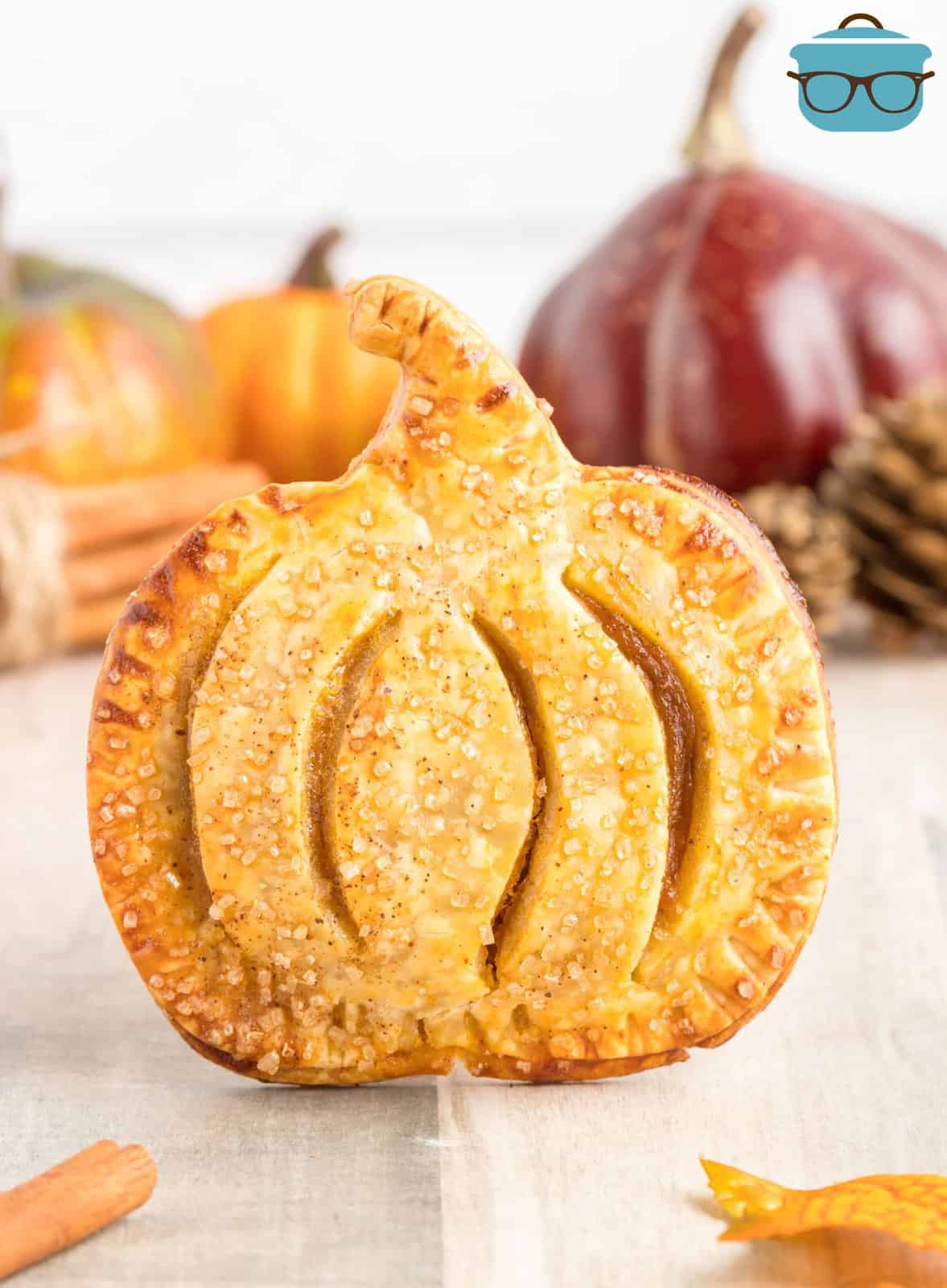 One of the Pumpkin Hand Pies propped up showing the pumpkin shape.