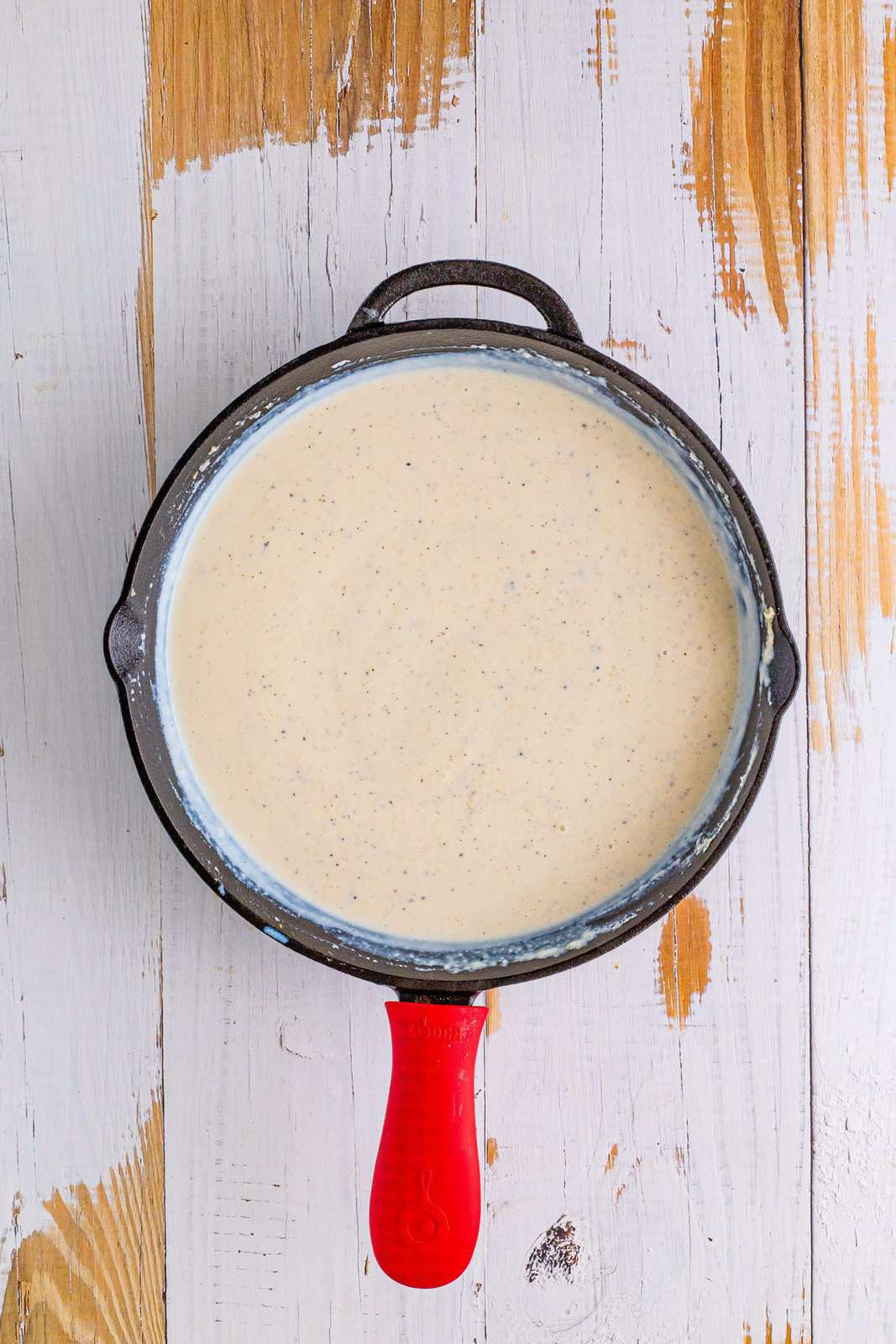 Milk, salt and pepper whisked into the flour mixture to create gravy.