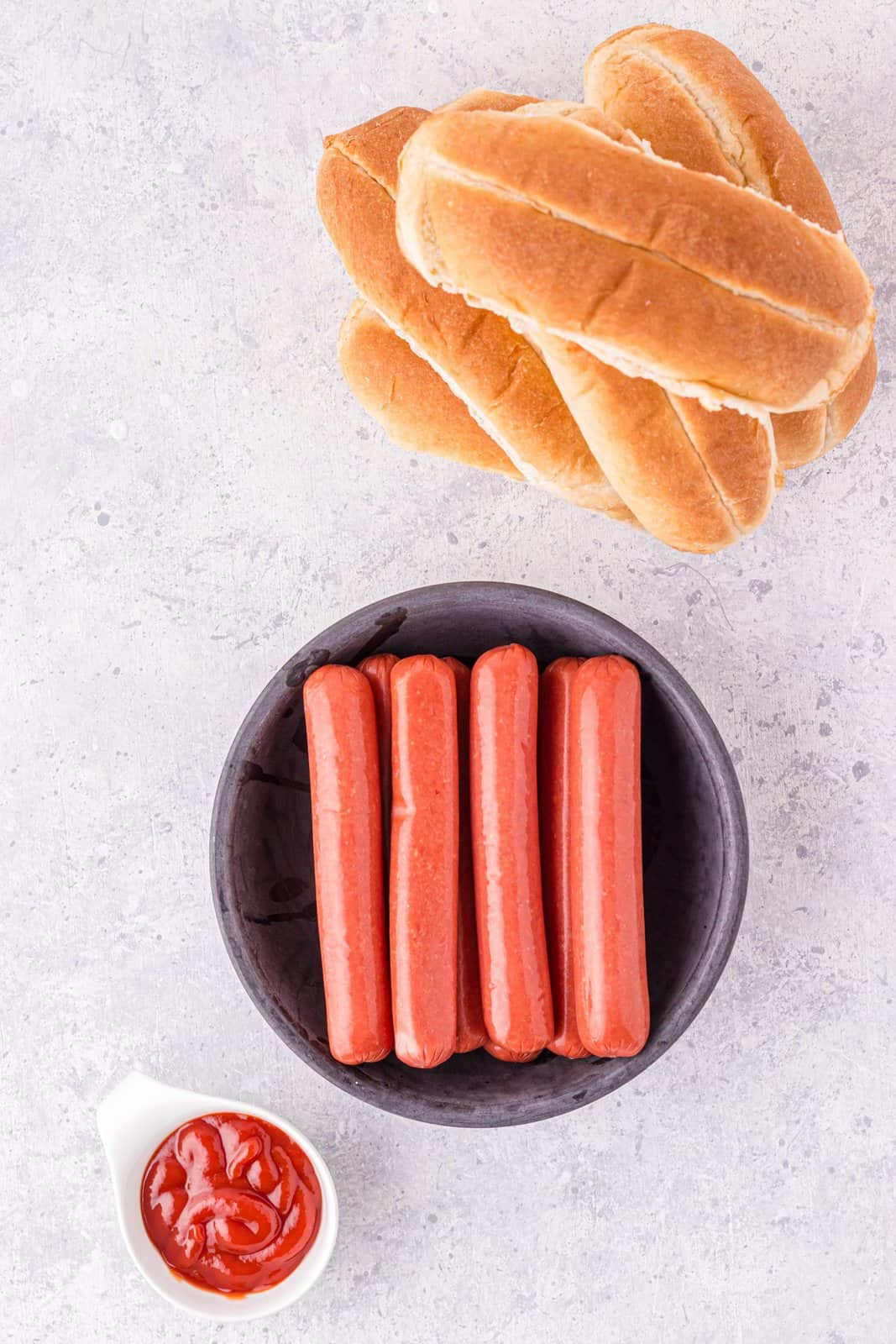 Ingredients needed: hot dogs, ketchup, hot dog buns.