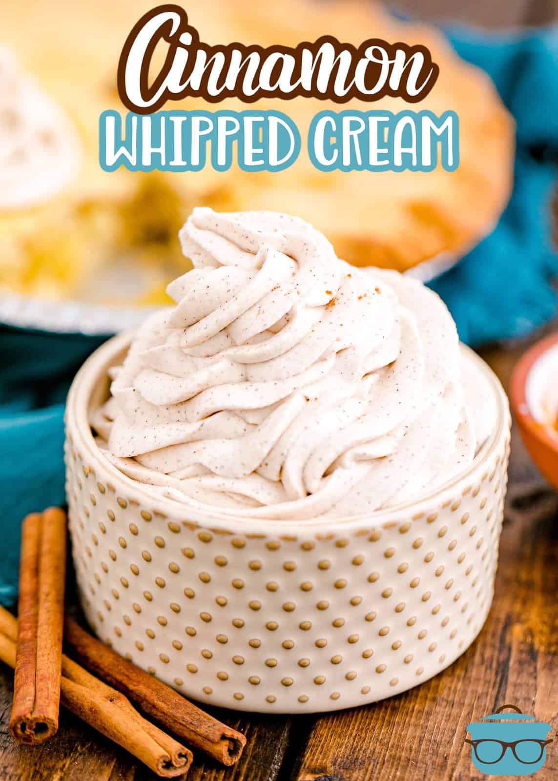 Pinterest image of swirled Homemade Cinnamon Whipped Cream in ribbed bowl.