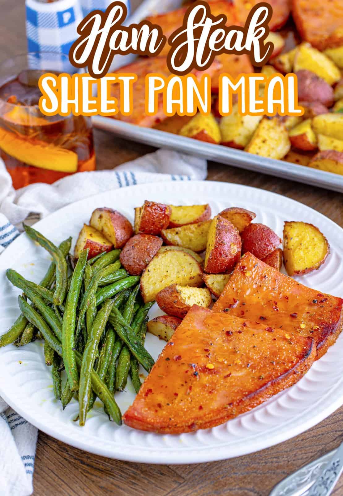 Pinterest image of Ham Steak Sheet Pan Meal on white plate.