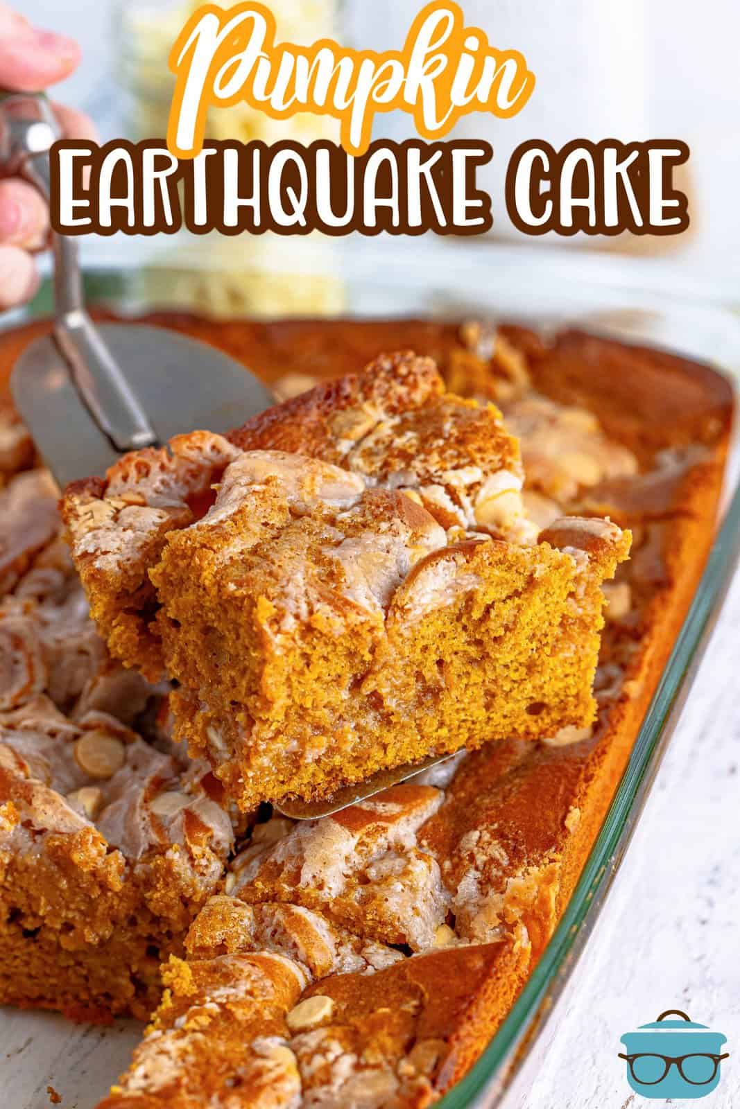 Pinterest image of cake server holding up a slice of the Pumpkin Earthquake Cake.