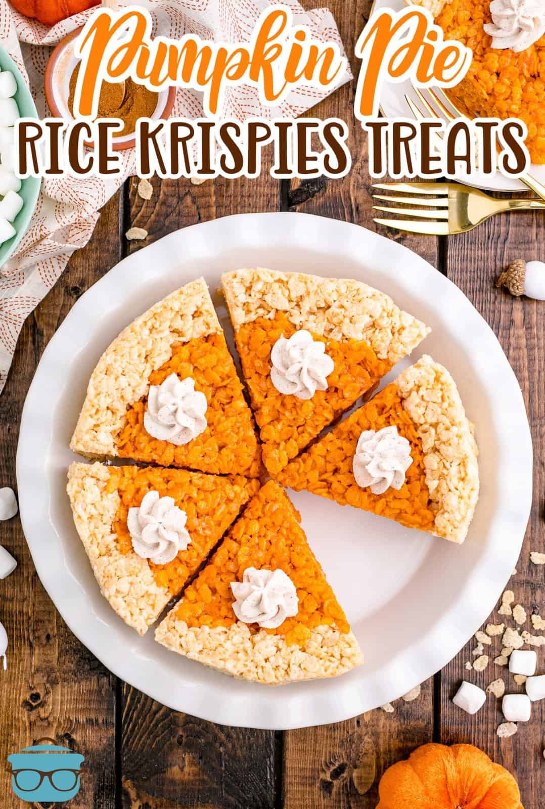 Overhead of Pumpkin Pie Rice Krispies Treats in pie plate with slices missing topped with cinnamon whipped cream Pinterest image.