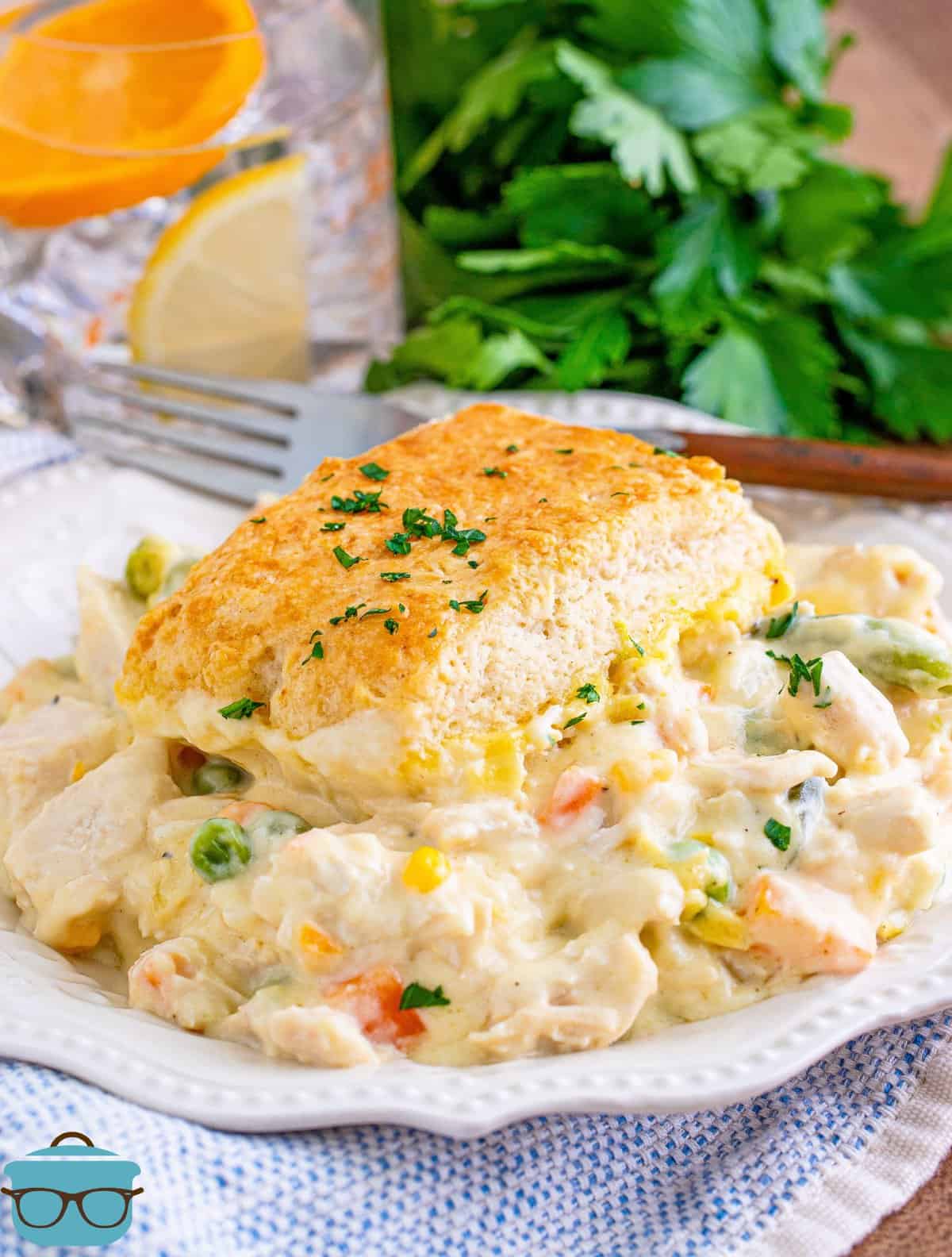 Turkey Pot Pie Casserole on white plate topped with parsley.