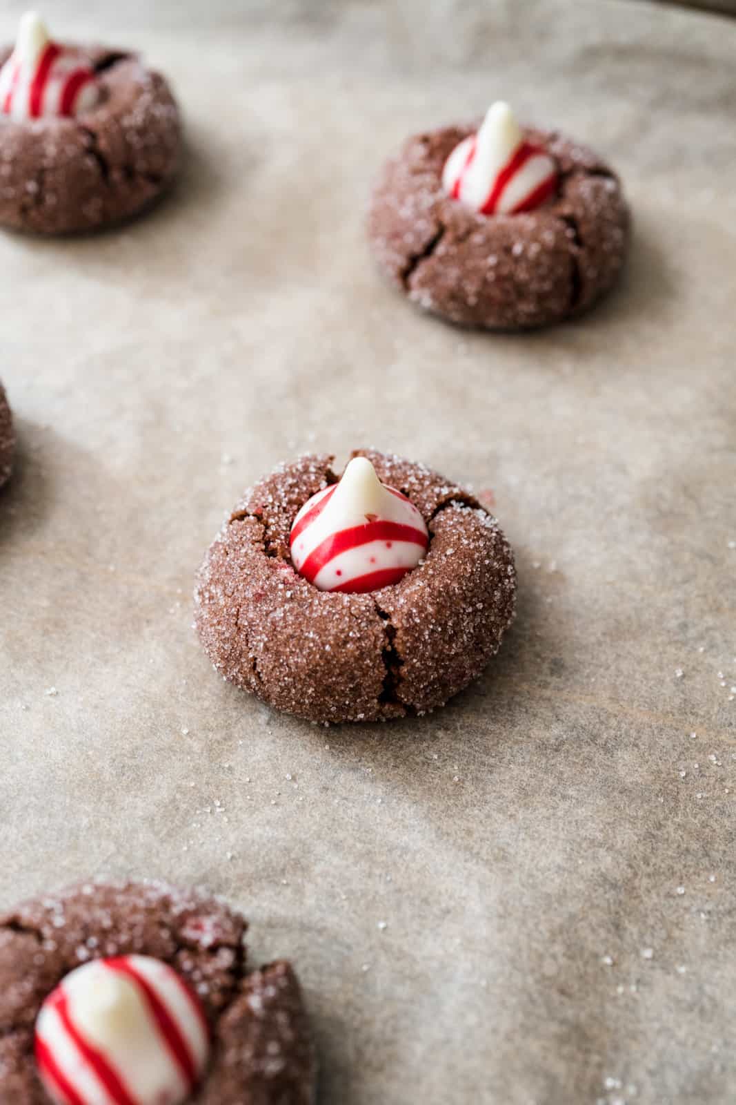 Candy cane kiss pressed into the top of baked cookies.