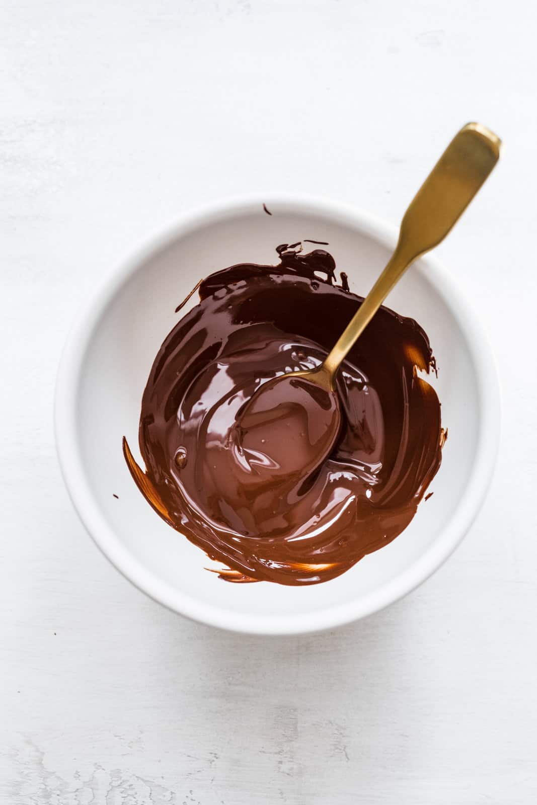 Melted chocolate in bowl.