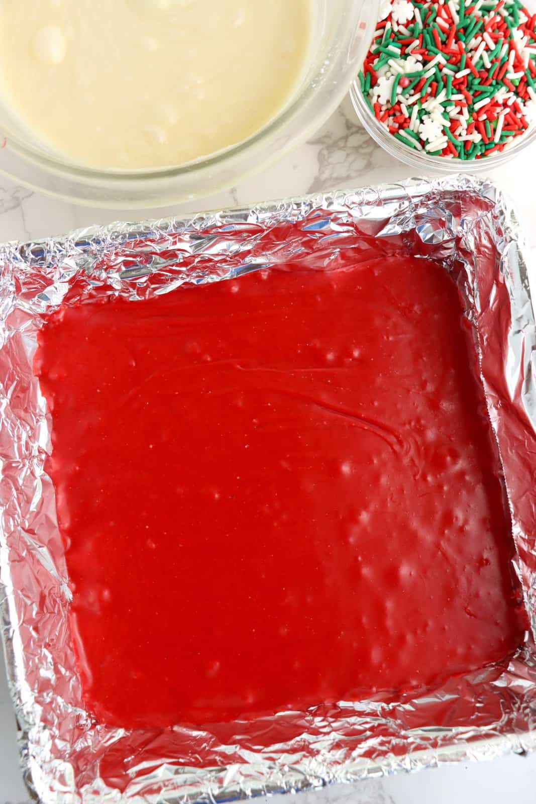 Red layer of fudge added to prepared pan.