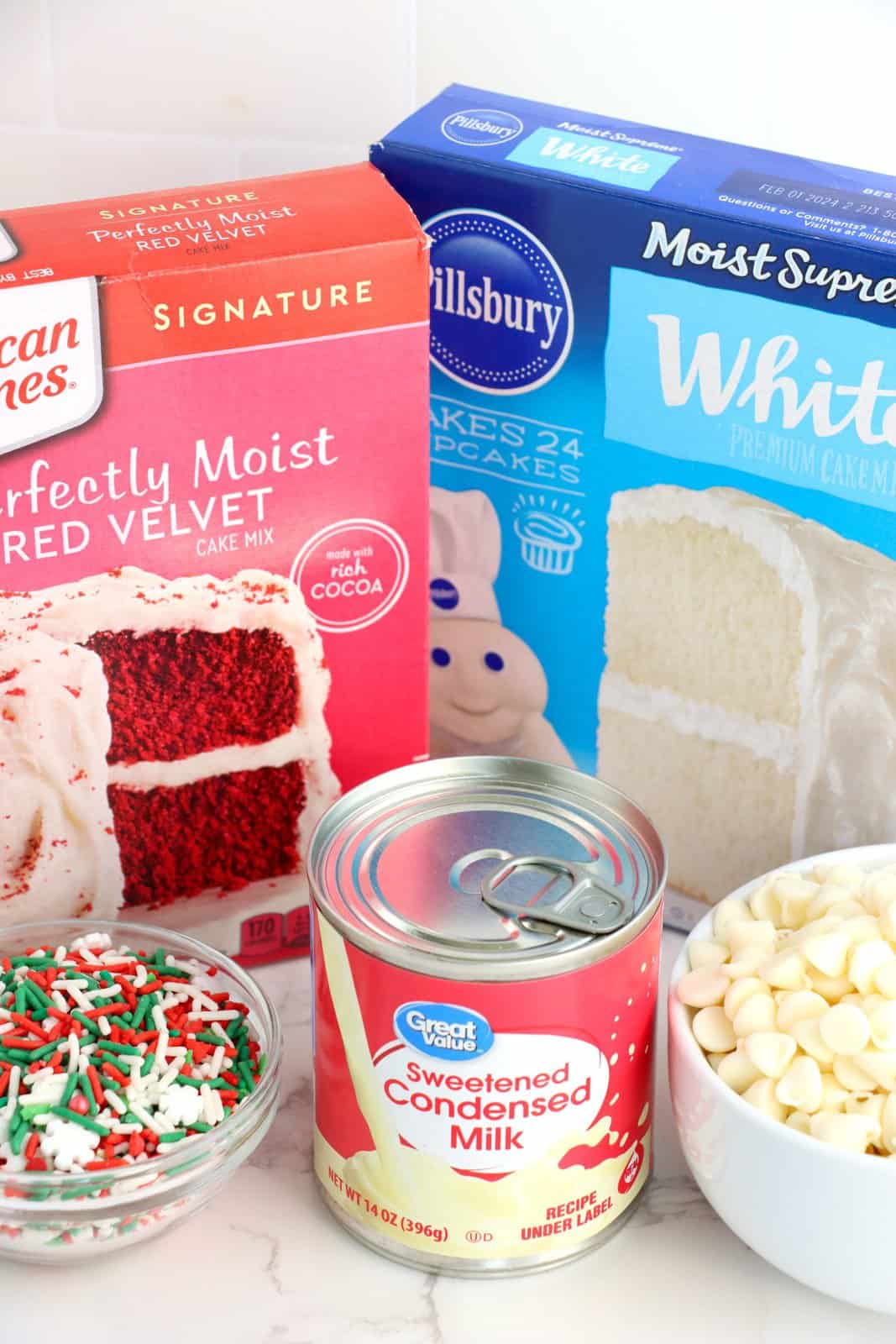 Ingredients needed: white chocolate chips, sweetened condensed milk, red velvet cake mix, white cake mix and sprinkles.