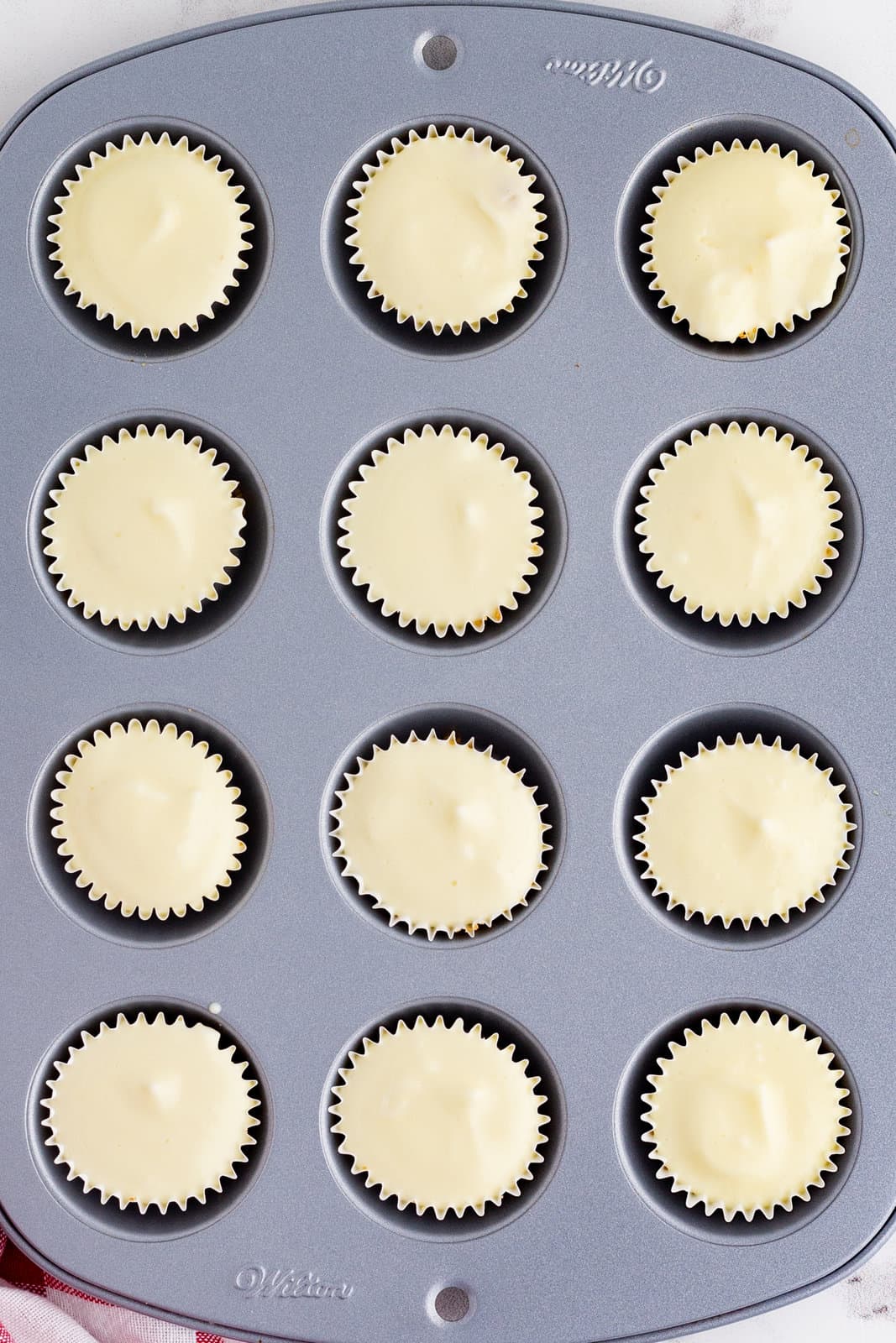 Finished mini cheesecakes in pan.
