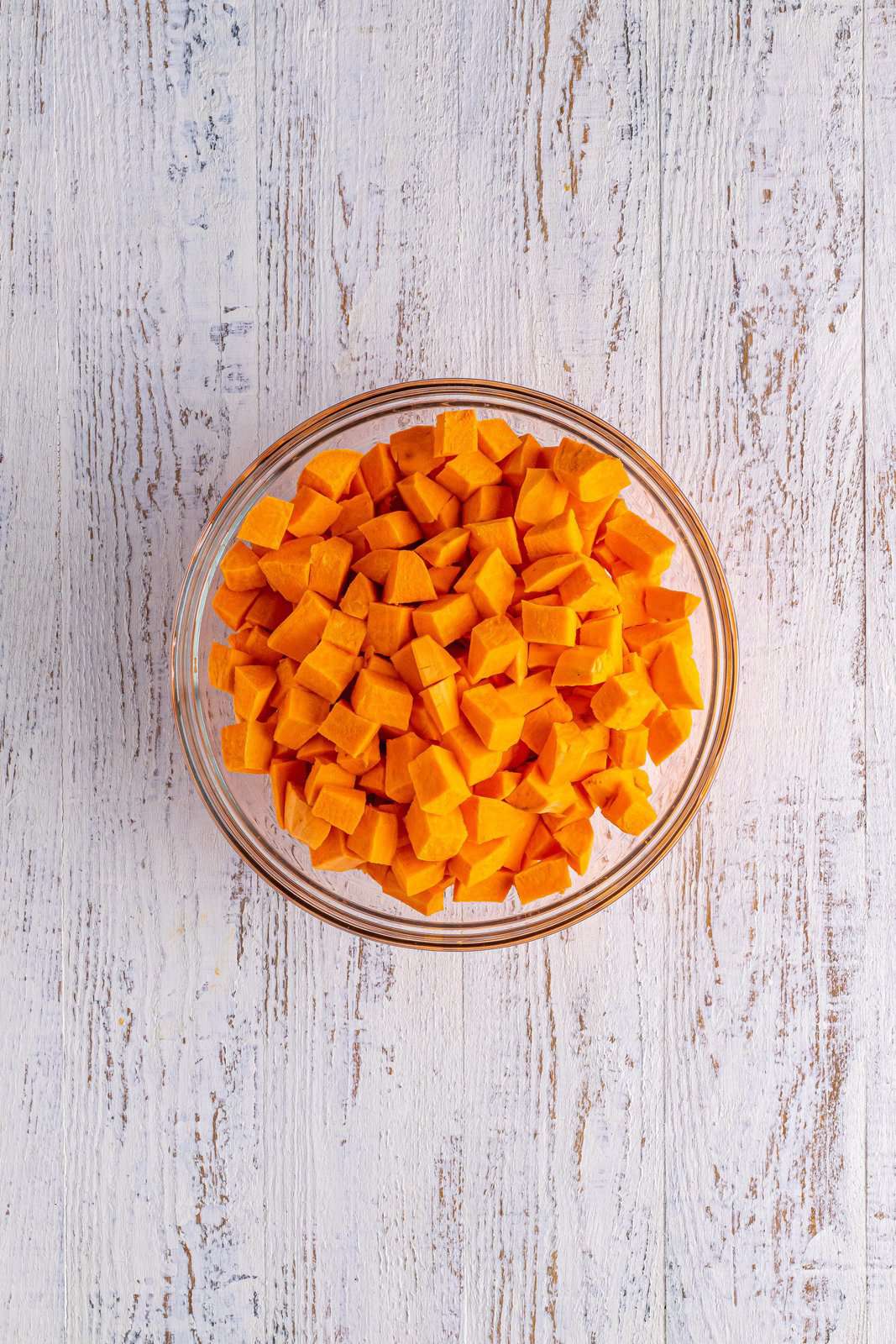 Diced sweet potatoes added to bowl.