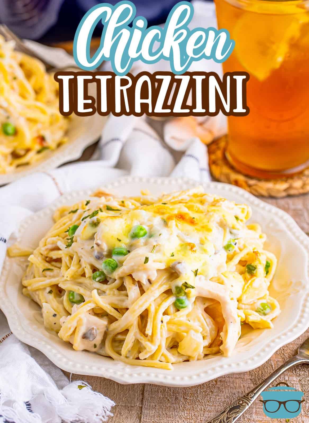Easy Chicken Tetrazzini on plate with tea in background, Pinterest image.