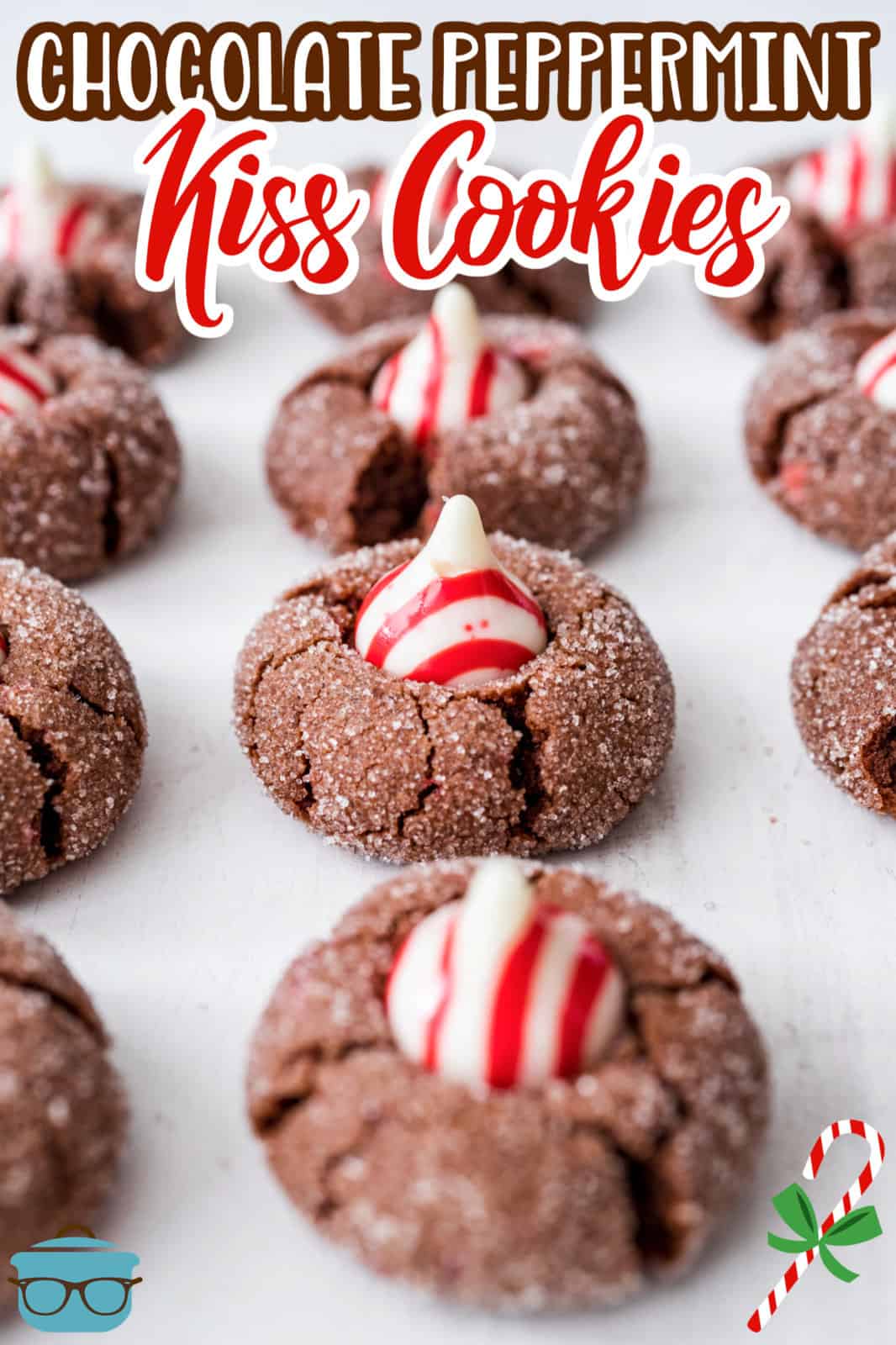 Lined up Chocolate Peppermint Kiss Cookies on white board, Pinterest image.