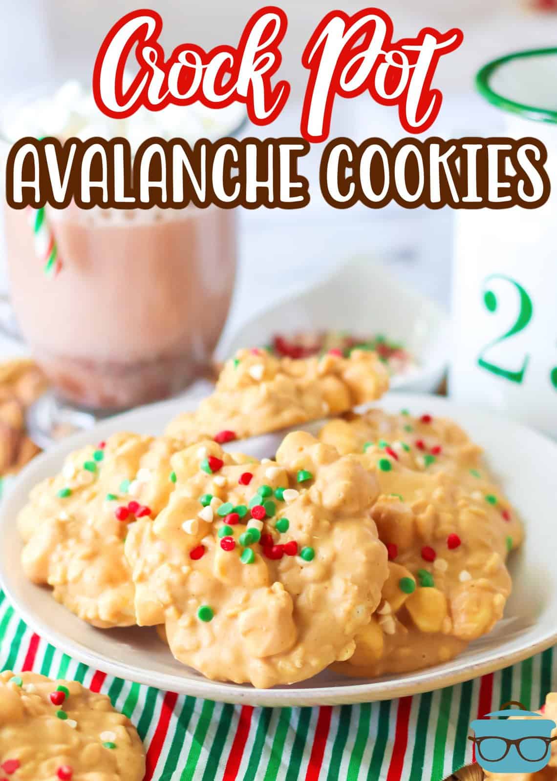 Pinterest image of Crock Pot Avalanche Cookies on white plate with hot chocolate in background.