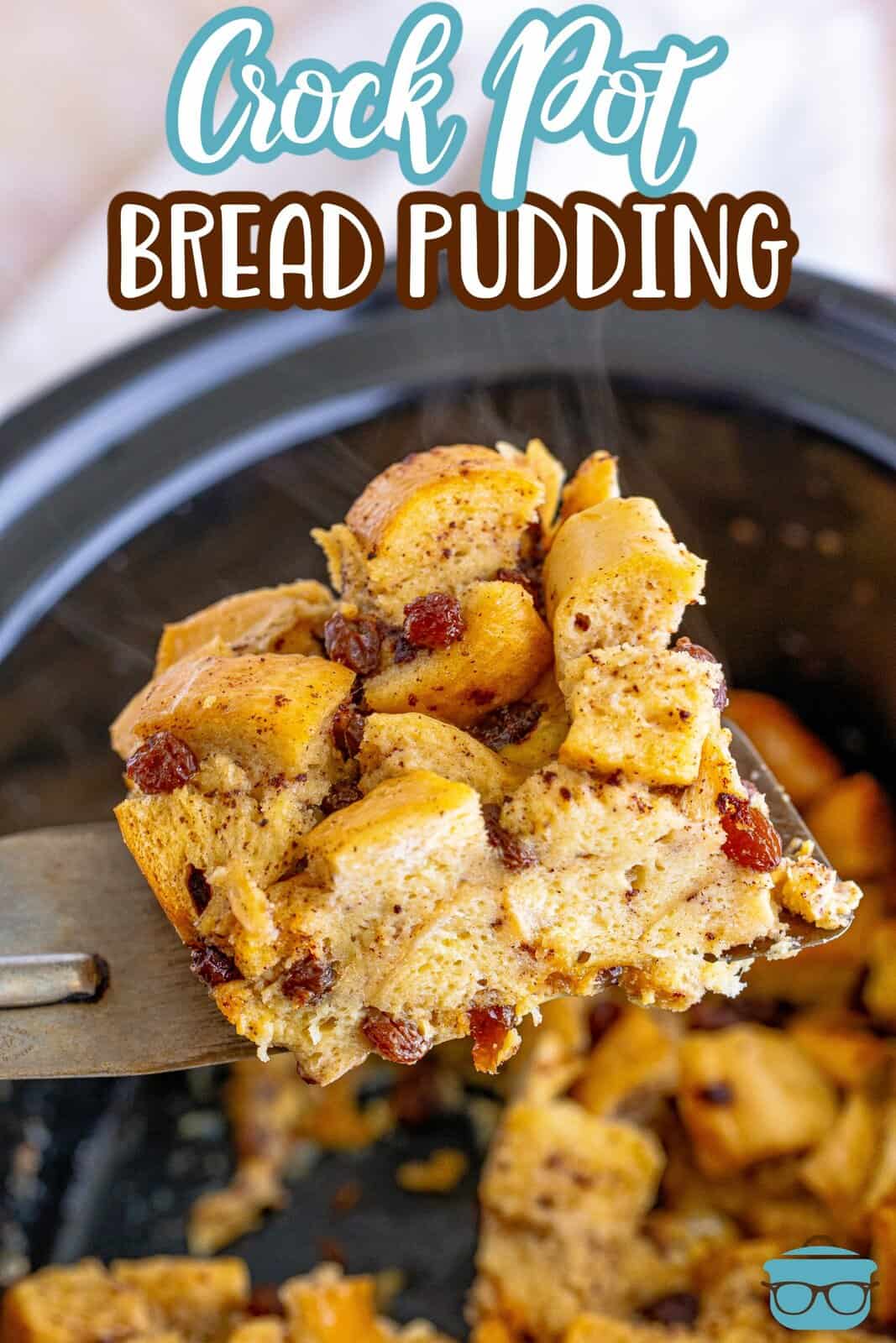 Spatula holding up a slice of the Crock Pot Bread Pudding out of crock pot Pinterest image.