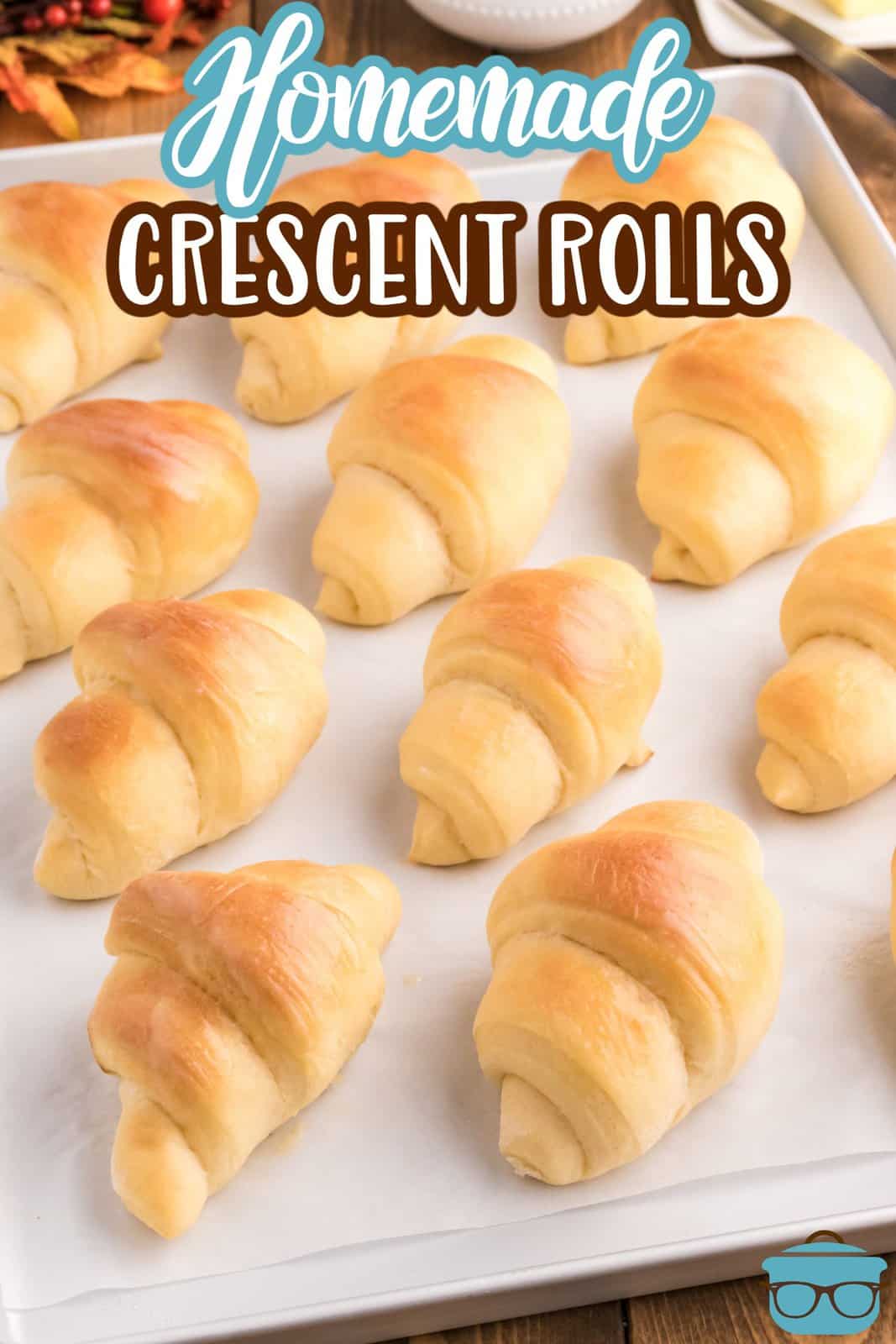Pinterest image of baked Homemade Crescent Rolls on baking sheet.