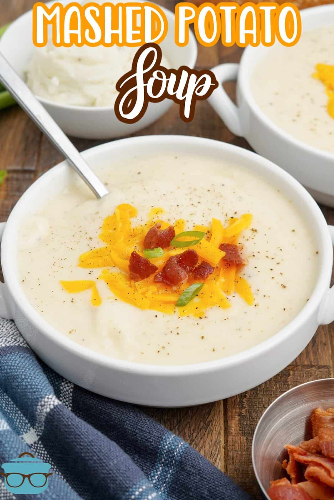 White bowl full of Mashed Potato Soup garnished with spoon in bowl, Pinterest image.