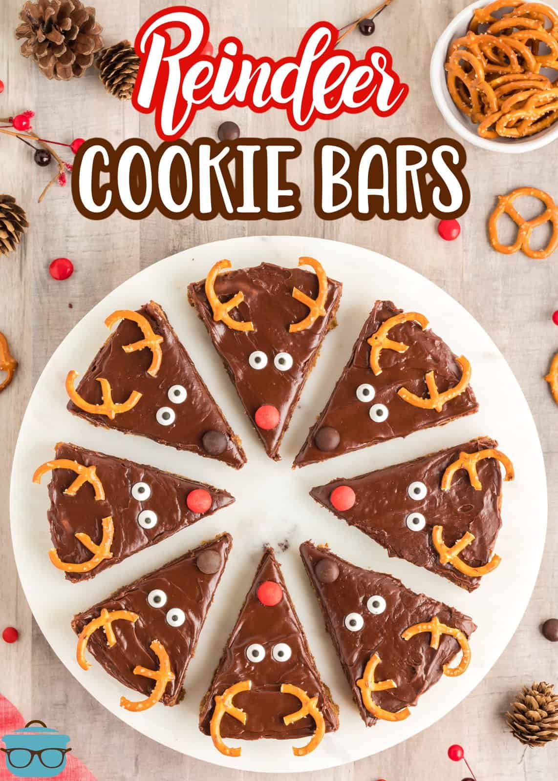 Overhead of cut Reindeer Cookie Bars on white platter.