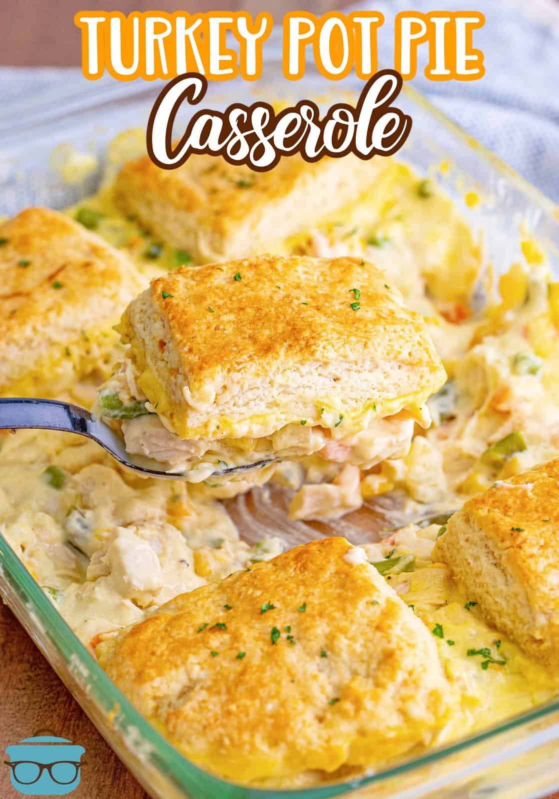 Pinterest image of serving spoon scooping out some of the Turkey Pot Pie Casserole from baking dish.