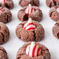 Close up square image of lined up Chocolate Peppermint Kiss Cookies.