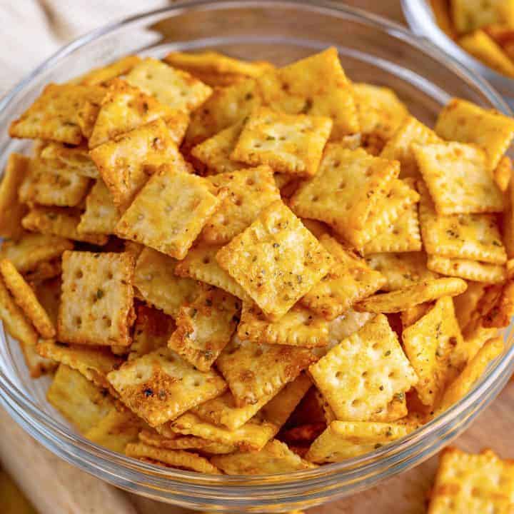 Close up square image of Seasoned Crackers in clear bowl.