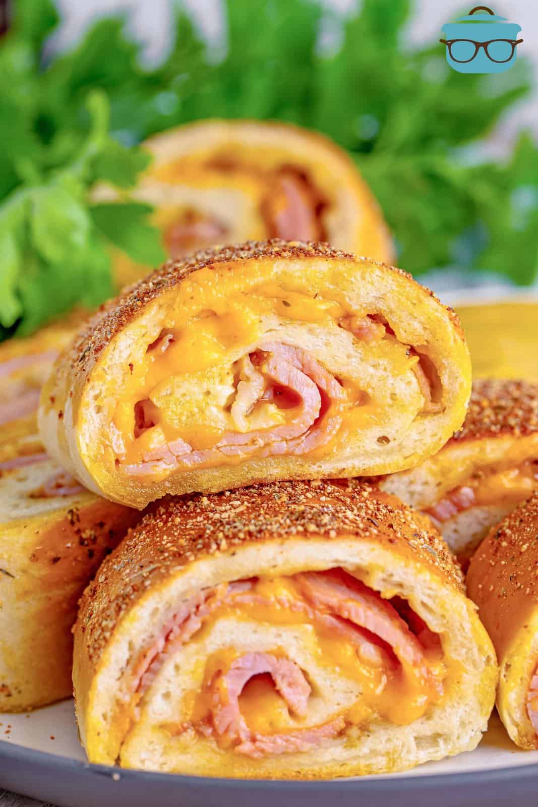 closeup photo of slices of Stromboli stacked on a plate. 