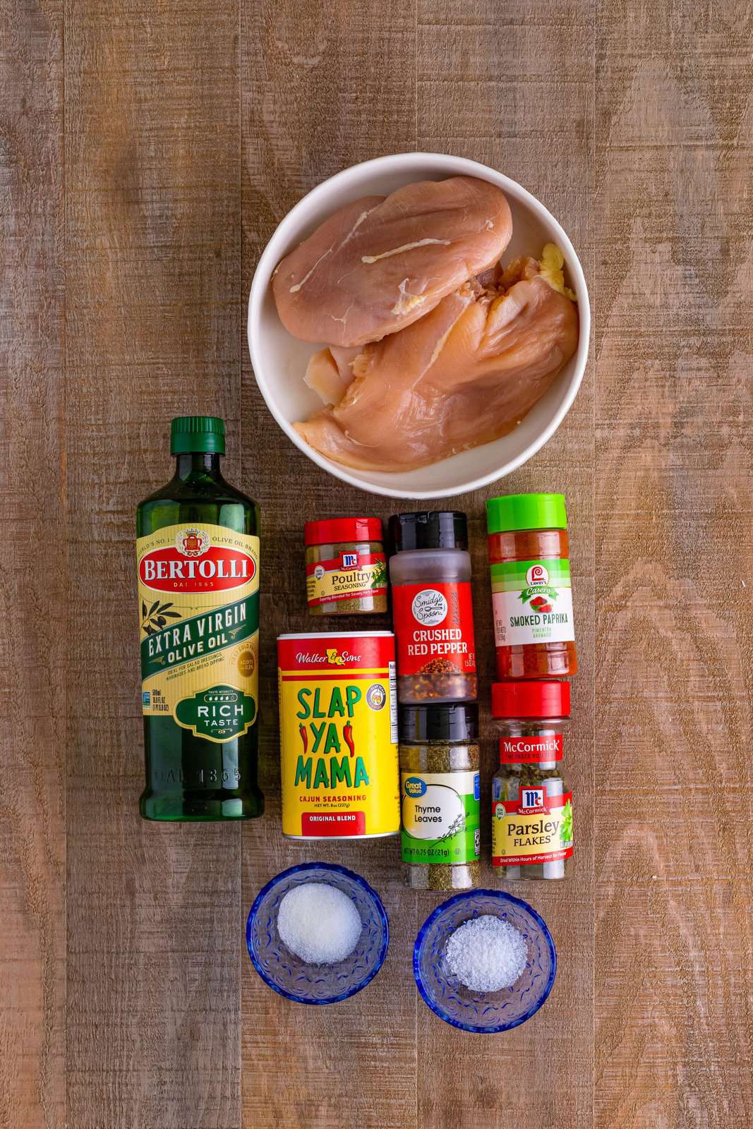 chicken breasts, olive oil, cajun seasoning, salt, paprika, red pepper flakes, poultry seasoning and dried thyme.