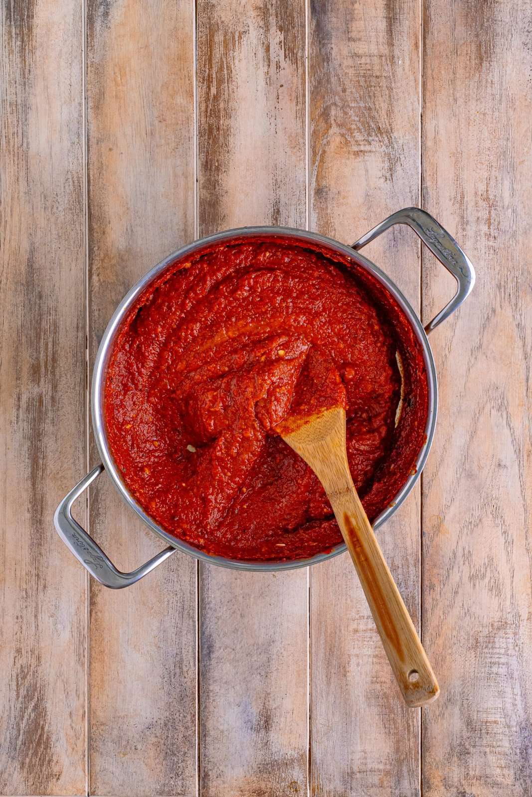 A skillet full of tomato sauce.