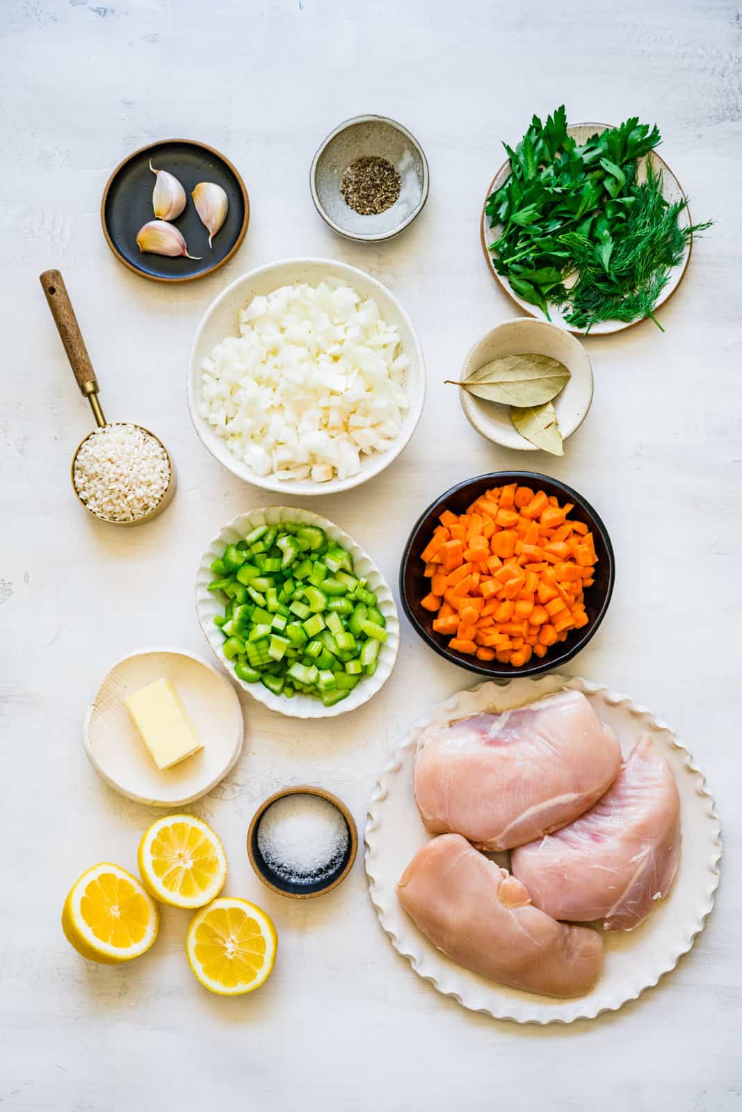 diced celery, diced carrots, lemons, chicken breasts, butter, garlic, rice, bay leaves and diced onions.