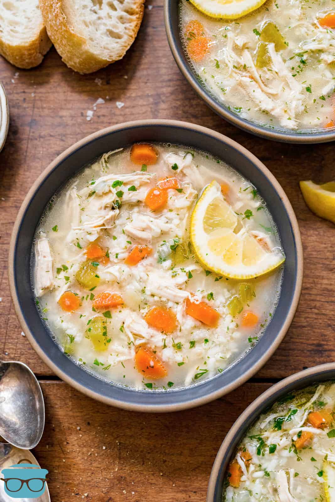 overhead photo of a bowl of lemon chicken soup with rice.
