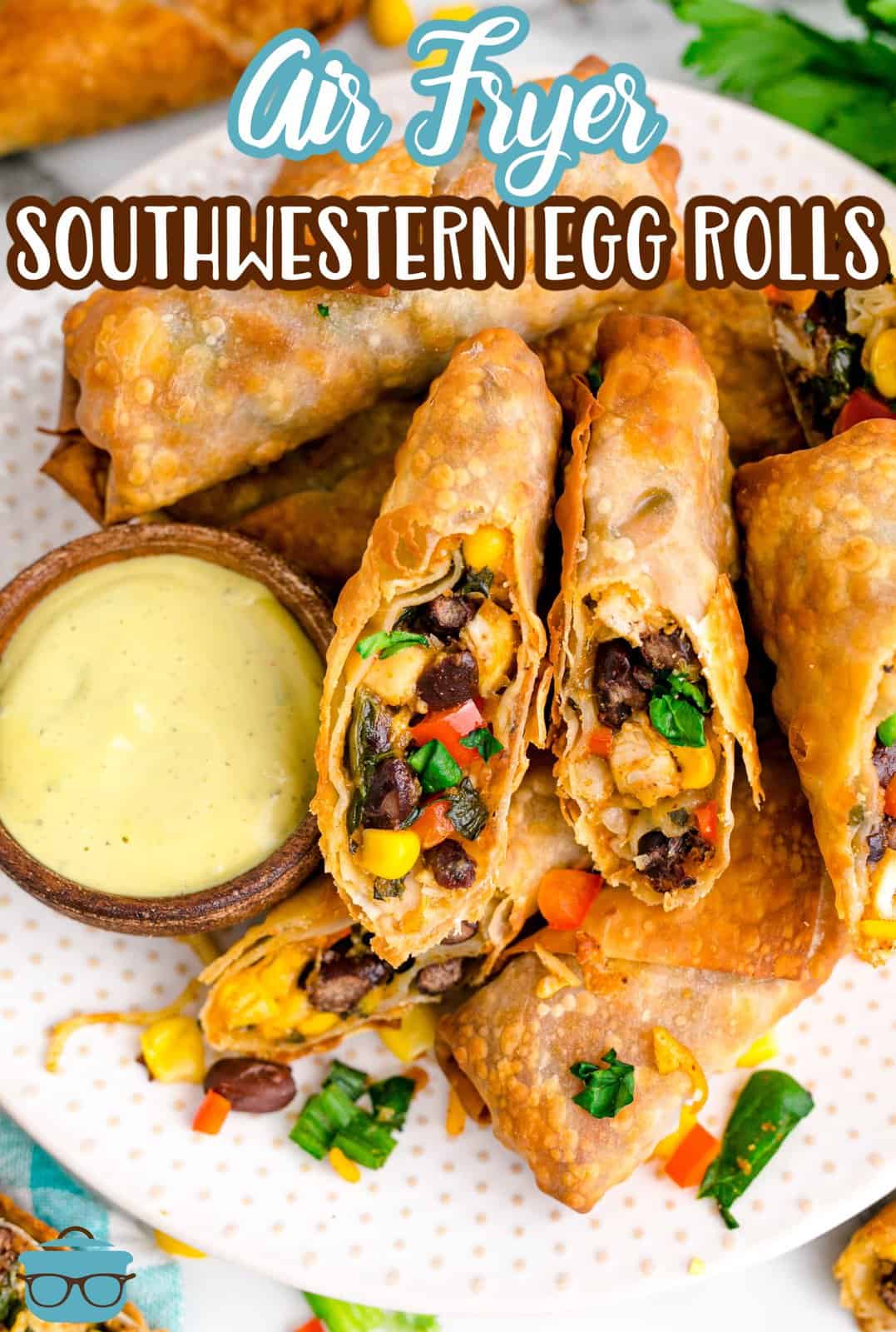 A plate of air fried Southwestern Egg Rolls with dipping sauce.