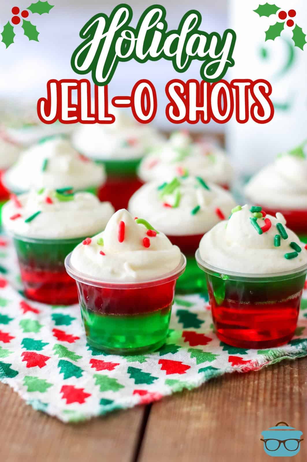 Pinterest image of Holiday Jell-O Shots on holiday linen garnished.