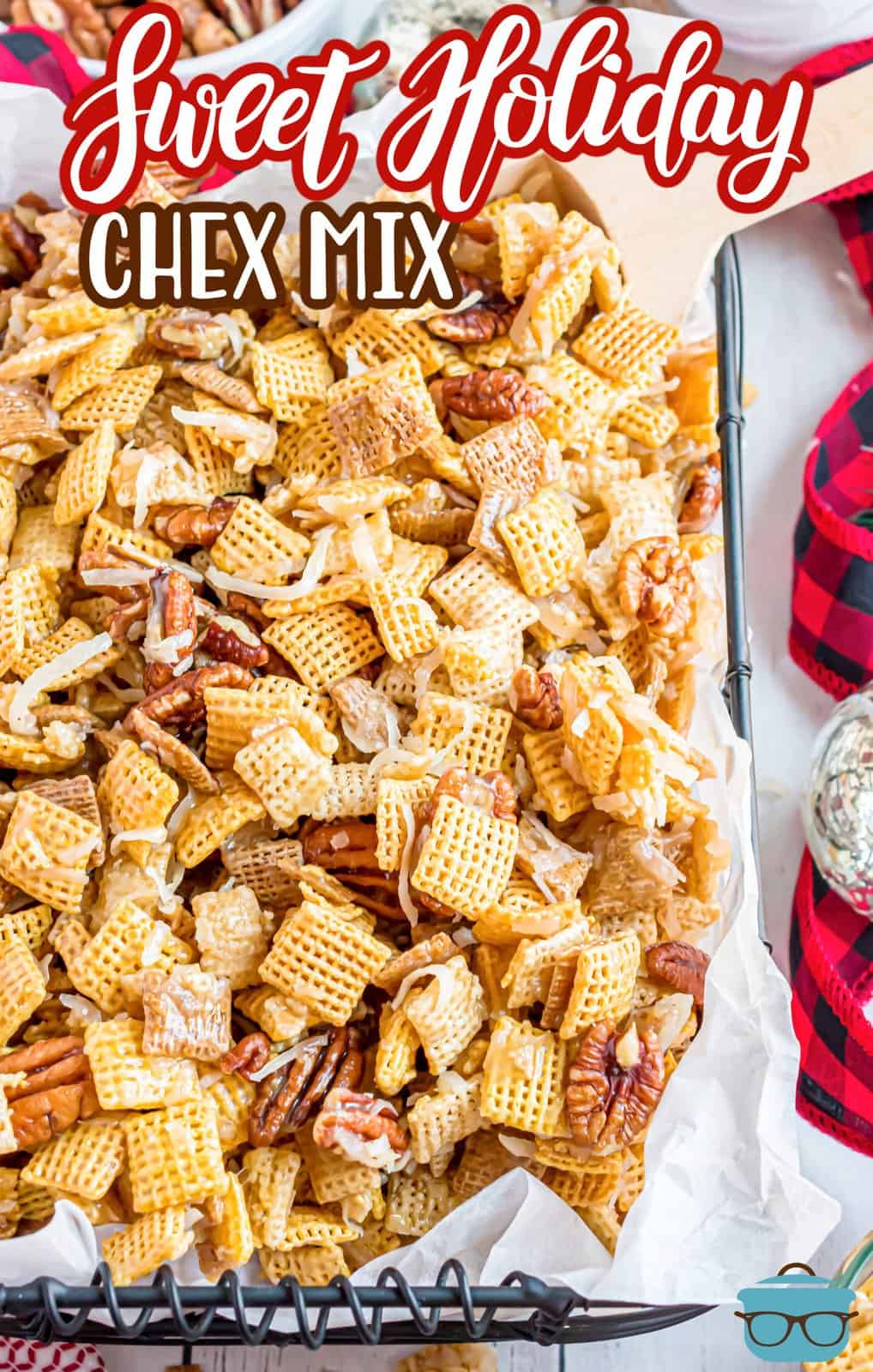 Pinterest image of Sweet Holiday Chex Mix with parchment paper on serving tray.