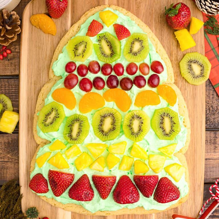 Overhead square image of finished and decorated Christmas Tree Fruit Pizza.