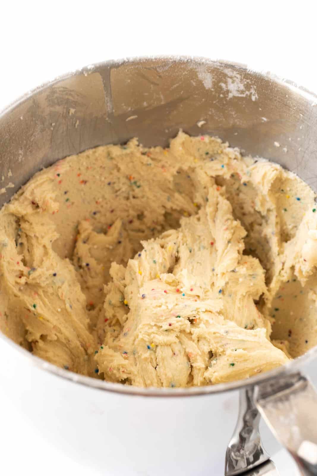 A mixing bowl with condensed milk cookie dough.