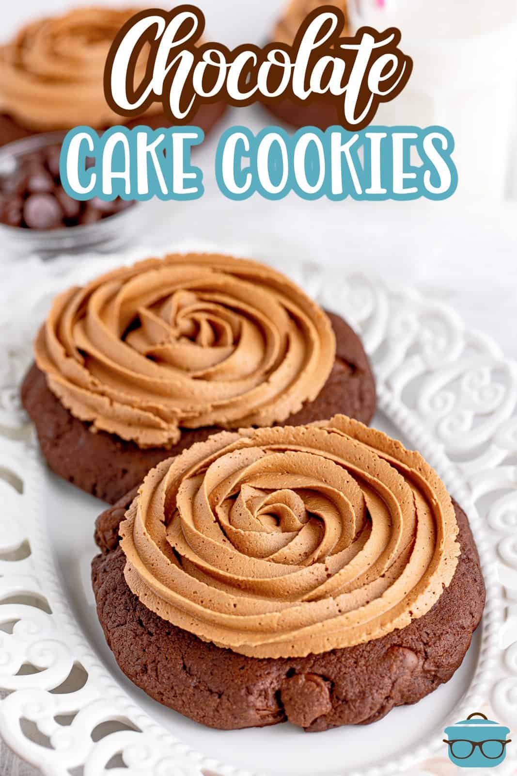 Two chocolate cake cookies with frosting on a plate.