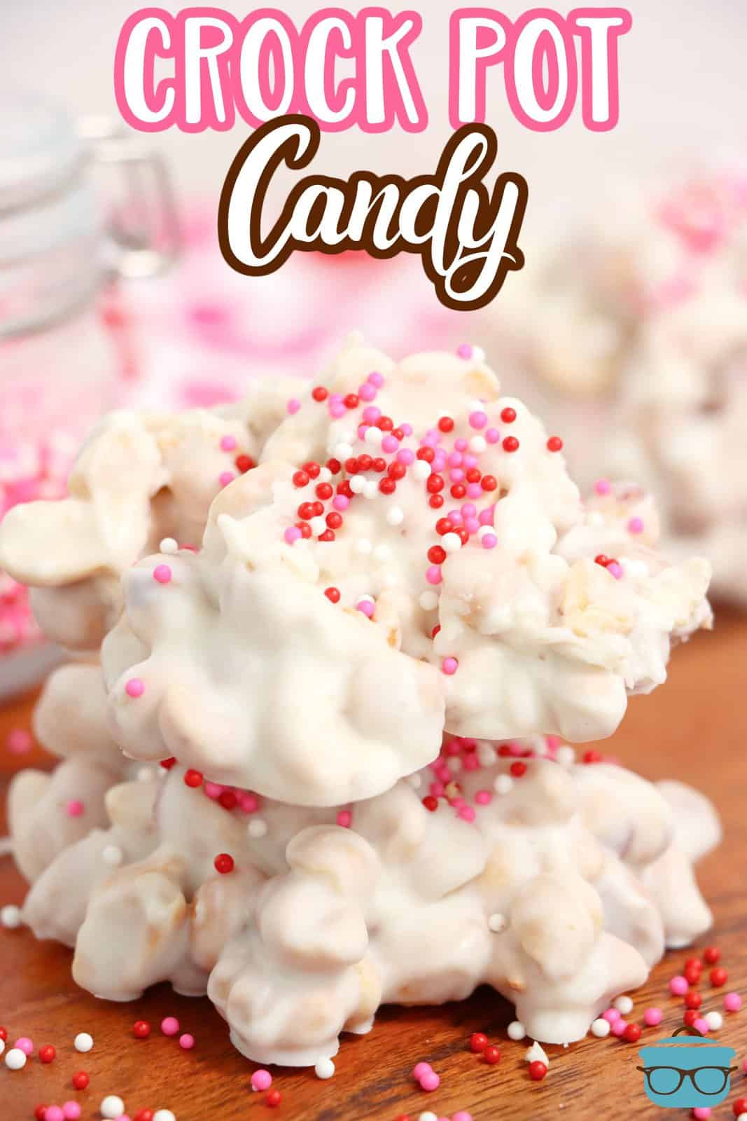 A pile of white crockpot candy with pink sprinkles on it.